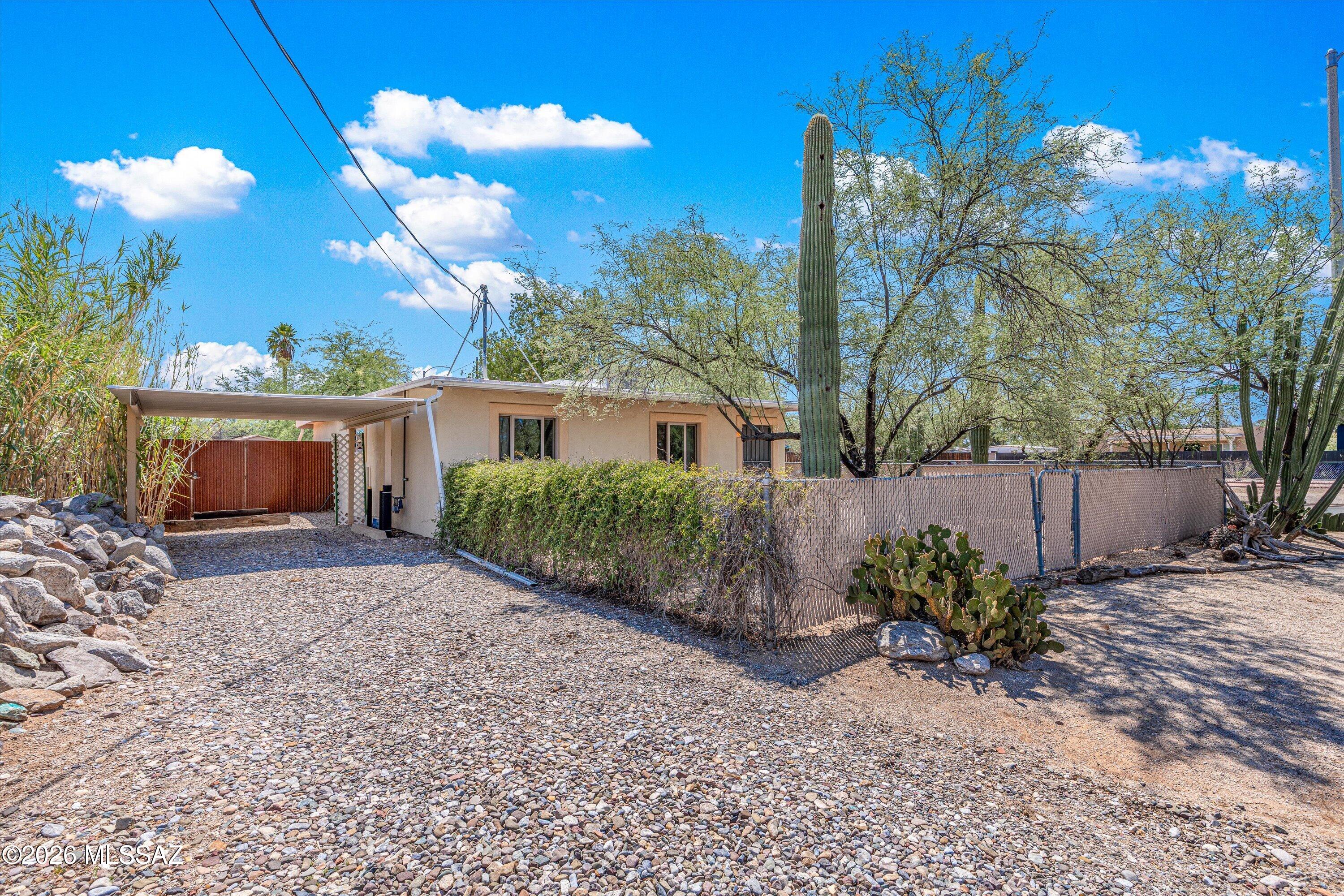 Charming corner bungalow on a spacious, fully fenced lot with a large rear yard and distinctive boojum tree. Updates galore include dual-pane windows, a new gas line, a sewer liner with a 50-year warranty, and newer HVAC and water heater. Conveniently located just minutes from restaurants, shopping, and everyday amenities.