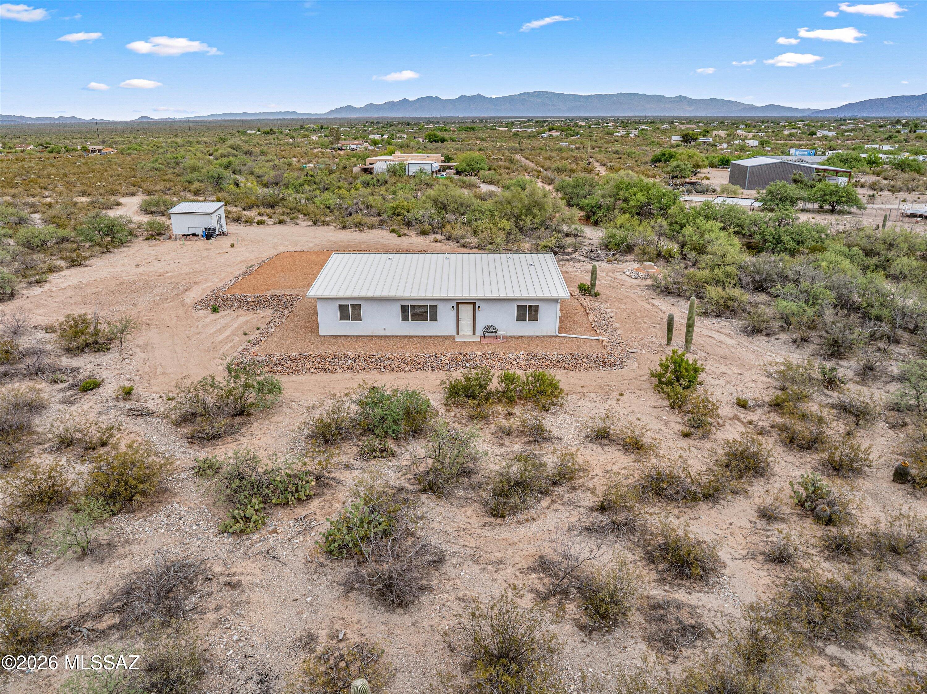 Brand new site-built home completed in December 2025 on 4.86 acres in the sought-after Vail School District. This new single family residence offers the perfect combination of modern comfort, open space, and future potential. The shared well provides convenience while the usable acreage offers endless possibilities for horses, a shop, garage, barn, guest quarters, or additional outbuildings. Durable metal roof. Bring your animals, RVs, and toys and create the lifestyle you have been looking for. Inside, all appliances are included, making this home truly move-in ready. Enjoy peaceful country living with room to grow, expand, and make this property your own while still being within easy reach of town, schools, and everyday amenities.