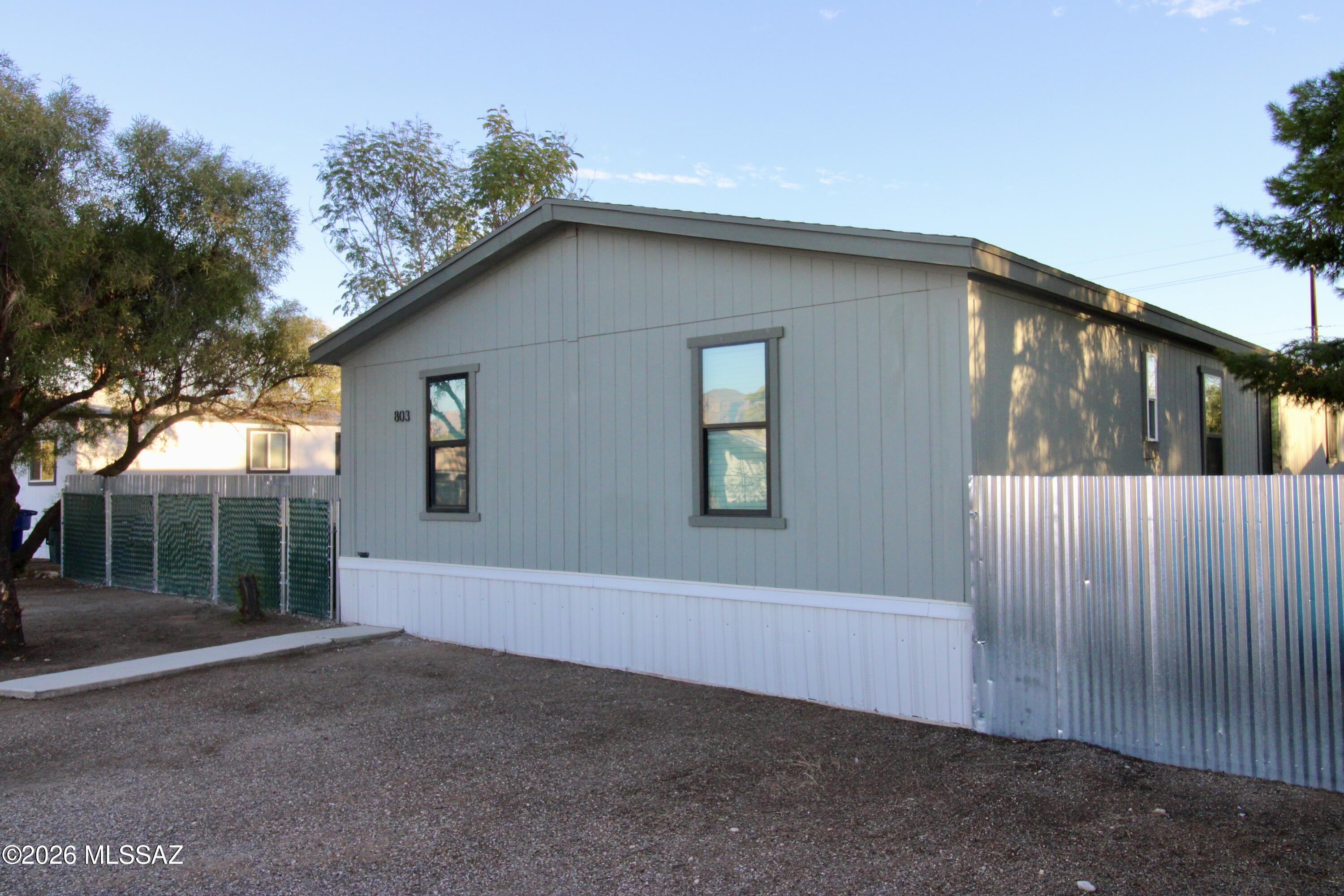 Upgraded 5-bedroom, 3-bathroom home, offering 1,792 square feet of living space in the desirable Collen subdivision. Conveniently located near I-10 and the heart of Central Tucson. Completely remodeled interior, featuring brand-new dual-pane windows for enhanced energy efficiency, and durable vinyl flooring that adds style and ease of maintenance. The kitchen has been beautifully upgraded with granite countertops, a spacious farm sink, and new stainless steel appliances. This home includes 3 spacious walk-in closets and a huge laundry room that adds to the convenience. Freshly painted inside and out. The fully fenced yard offers privacy and a perfect outdoor space for relaxation or entertaining.