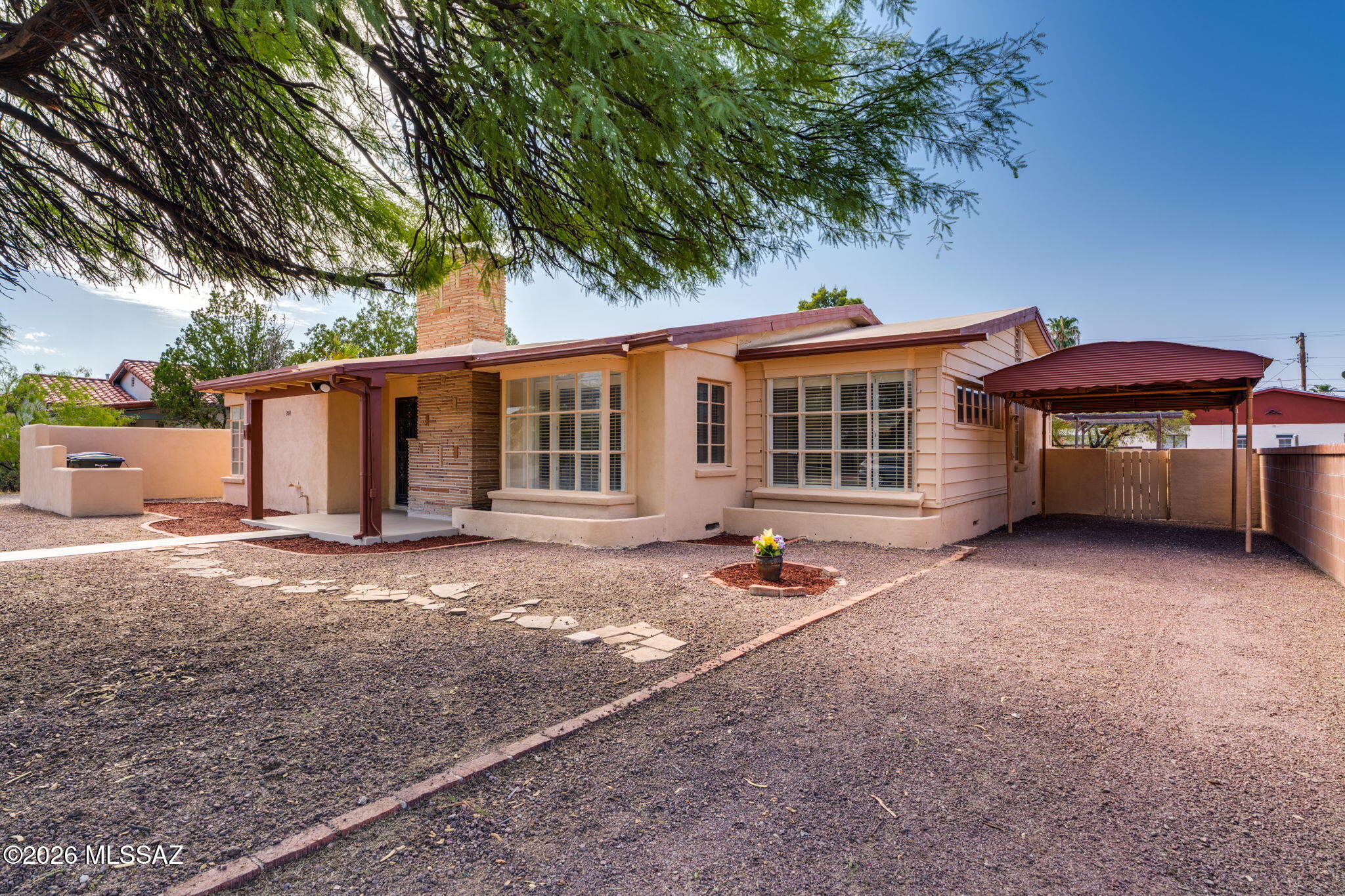 Charming mid-century classic! 3BR 2BA, walking distance to the UA and Banner Hospital. Come see this well maintained house in the desirable Blenman-Elm Neighborhood! Featuring beautiful wood floors, original bathroom and kitchen, and an abundance of natural light, with wood shutters throughout. The three spacious bedrooms offer ceiling fans and large closets. The ample living room boasts a lovely fireplace, prefect for relaxing or entertaining. Step outside to a large yard with a gazebo, providing ample space for a future ADU or guest house.