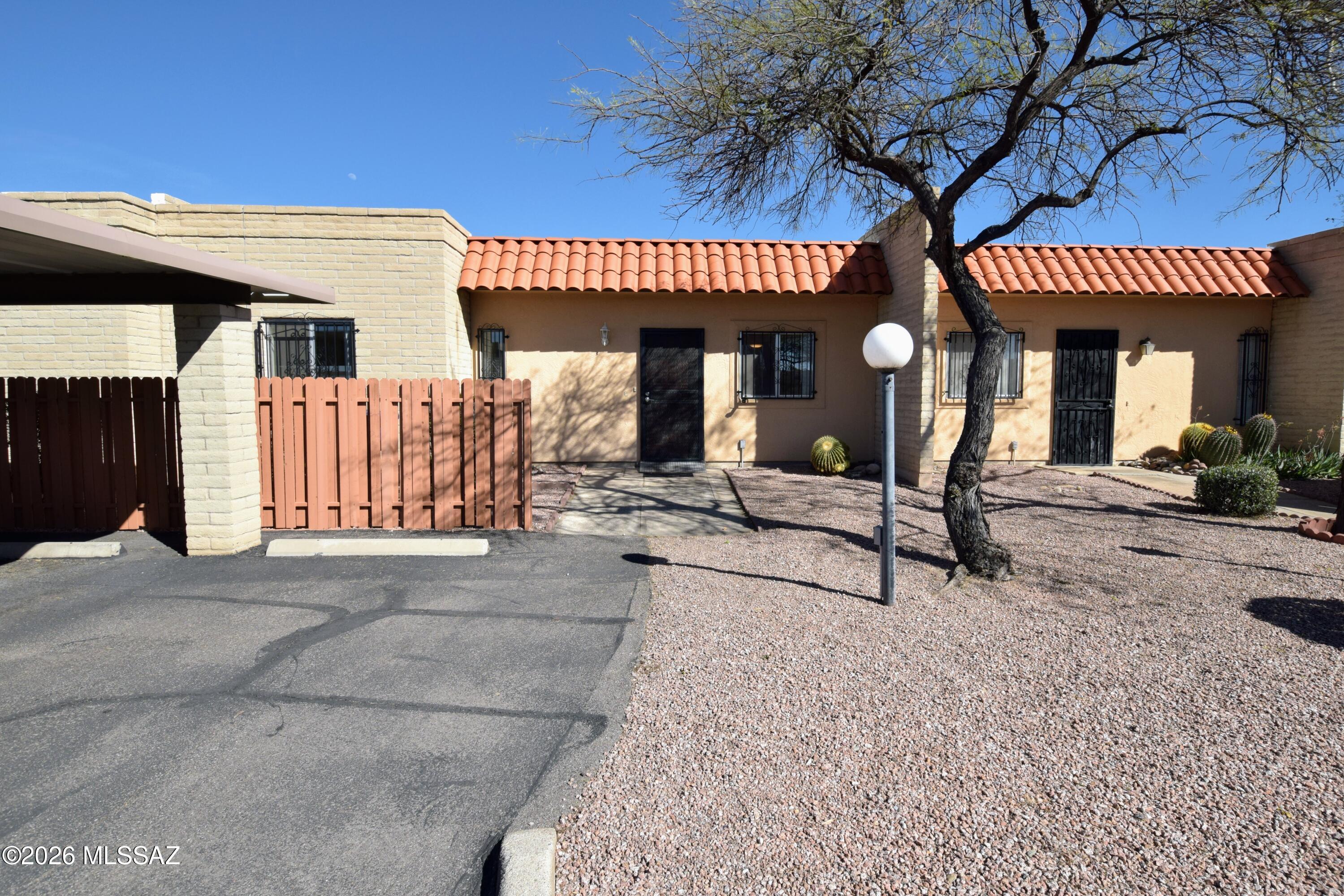 Experience effortless desert living in this beautifully updated 2 Bed 2 Bath 1,138-square-foot townhome located in the desirable Pantano Park community of East Tucson. This bright and airy residence features a modern open-concept kitchen and living area flooded with natural light, complete with crisp white cabinetry, a convenient breakfast bar, and ample indoor storage. Durable laminate and tile flooring run throughout the home, complemented by central heating and air conditioning and ceiling fans in the living room and both bedrooms for year-round comfort. The primary suite serves as a private retreat with an updated bath featuring a sleek, no-curb shower, while the hall bathroom boasts a modern vanity and contemporary fixtures. For outdoor enthusiasts, this home is perfectly positioned just steps from "The Loop" walking and biking path, and you can unwind on your private, full-length covered Saltillo tile back patio. Residents enjoy access to premium community amenities, including two sparkling pools, a spa, and tennis court. This home includes a full-size washer and dryer, covered off-street parking for two vehicles. This property is offered to NON-SMOKING TENANTS ONLY. Pets are subject to approval.