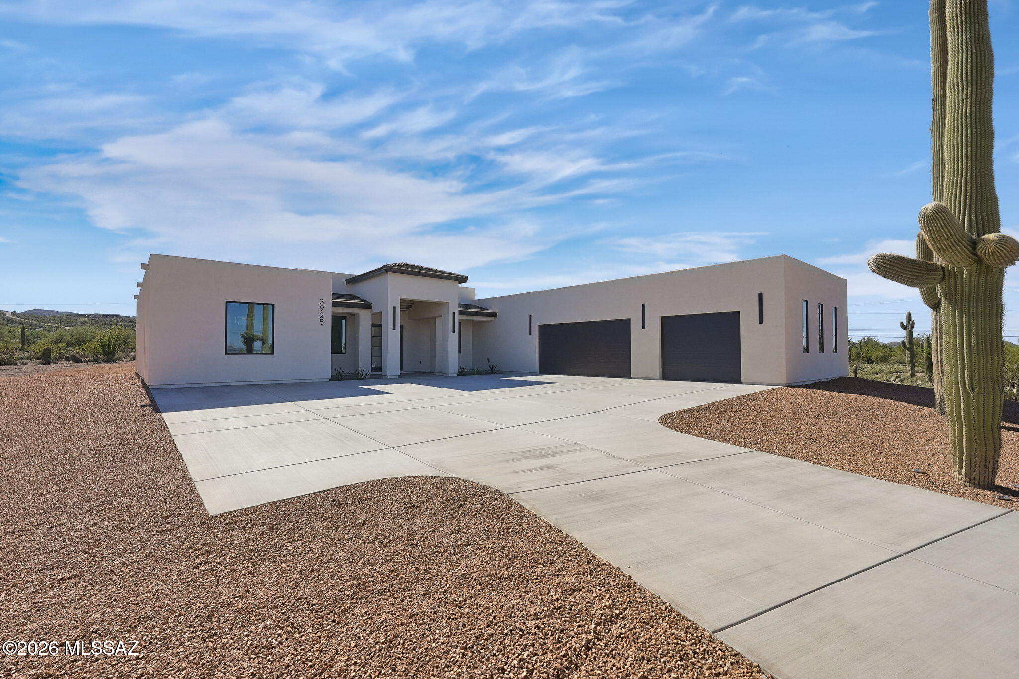 An exceptional offering in the West Tucson Mountain foothills - a newly completed modern estate offering 3,061 sqft of living space (4,823 total under roof), where every detail was chosen with intention. The chef's kitchen is appointed with premium Z-Line appliances, luminous white quartz countertops, a commanding 48-inch gas range. The primary suite is a private spa retreat, with a sculptural freestanding soaking tub and an expansive shower framed in glass. The home includes a guest living en-suite for family or friends. Set on 3.44 pristine acres, with sufficient space to create your own private retreat, all wrapped in unobstructed mountain views -- yet minutes from premier shopping and golf. Seller concessions offered with an acceptable offer. Agent/Owner