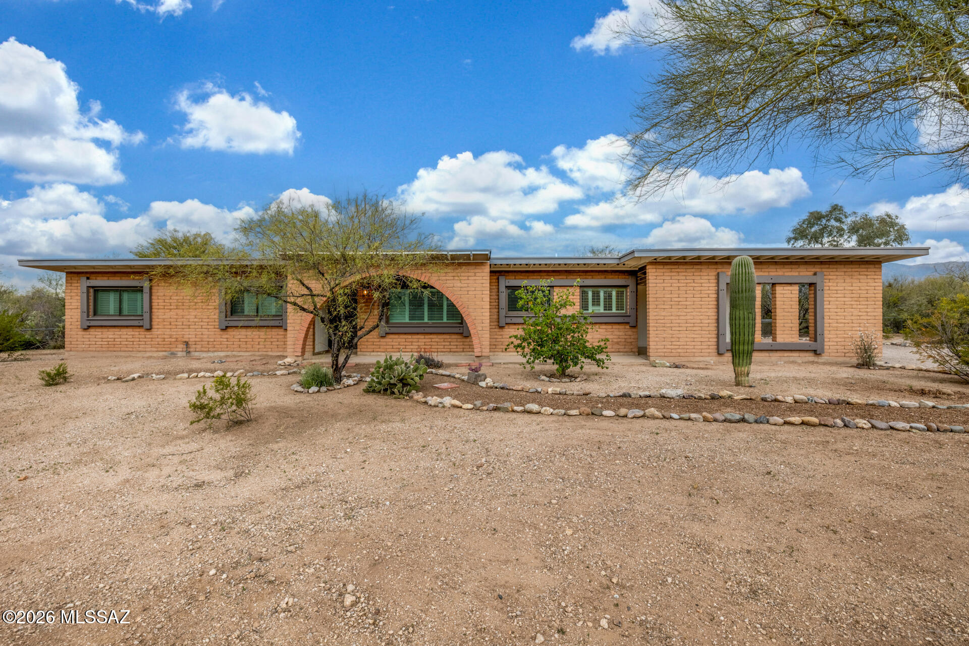 Beautifully Updated Ranch home on .70  Acres in Coveted Northeast Tucson! Charming slump block ranch built in 1979, thoughtfully upgraded throughout. Enjoy mountain views and room for hobbies, gardens, or future expansion. The interior features stylish luxury plank flooring and fresh paint. Gorgeous new kitchen with warm brown cabinetry, Quartz counter tops, stainless steel appliances, and modern plumbing and electrical fixtures. Bathrooms are fully remodeled with new cabinets, counter tops, elegant tile shower surrounds, and contemporary fixtures. Brand-new roof and exterior paint provide lasting quality and curb appeal. Experience modern comfort and timeless Tucson character in a peaceful Northeast setting close to shopping, dining, and schools. Well established community. Move-in ready