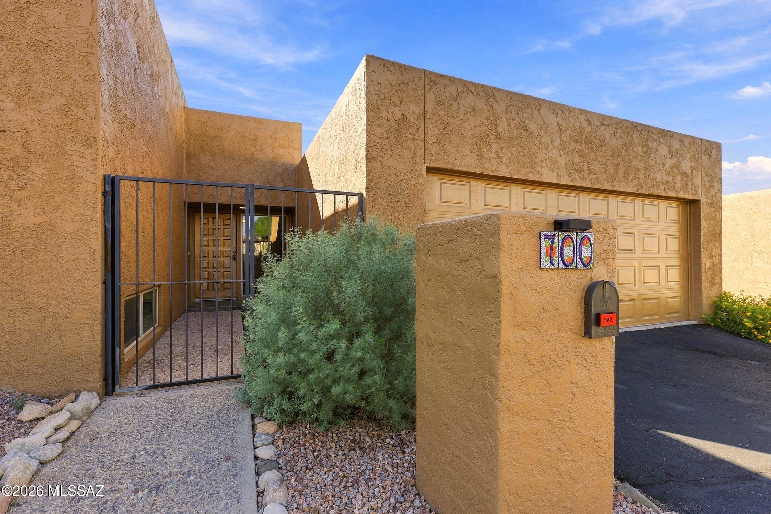 A Catalina Foothills address under $600,000 is rare enough- but this one comes with gorgeous architecture that makes you take notice. The split-level plan uses short half-flights to give each part of the home its own level, so living spaces and bedrooms each get room to breathe. It's a layout with  a little drama and lots of flexibility. Out back, a private patio works as an outdoor room for morning coffee, a grill, and a few potted plants, with no lawn asking for your weekends. Lock the door and travel whenever you want. The community is well kept and quietly tucked into the Foothills, close to the restaurants, shopping, and trailheads that make 85718 so appealing, with an easy drive to the University of Arizona and downtown.