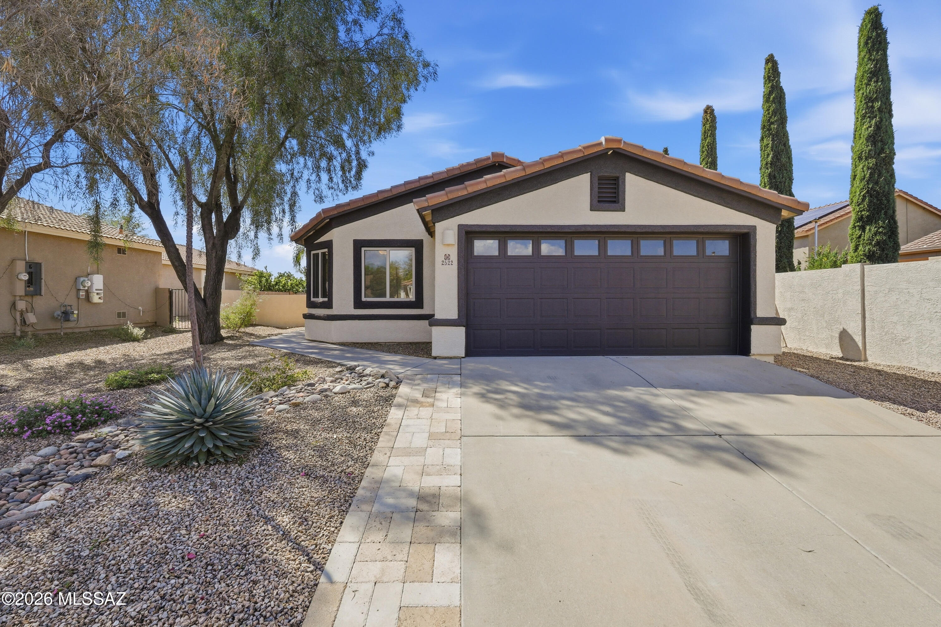 Enjoy beautiful mountain views in this nicely updated Oro Valley home offering 1538 sqft of thoughtfully designed livings space.  The open concept living, dining, kitchen creates an amazing flow perfect for everyday living and entertaining.  Kitchen features SS appliances, granite countertops and ample cabinetry with pantry.  This 4-bedroom home offers a split bedroom floorplan providing privacy for the primary suite.  Recent upgrades include a new roof, fresh interior and exterior paint, fixtures and brand-new carpet in all bedrooms-making this home truly move in ready.  Ideally located near shopping, restaurants, medical and hiking and biking trail conveniences with spacious yard and mountain views.  Don't miss seeing the opportunity.
