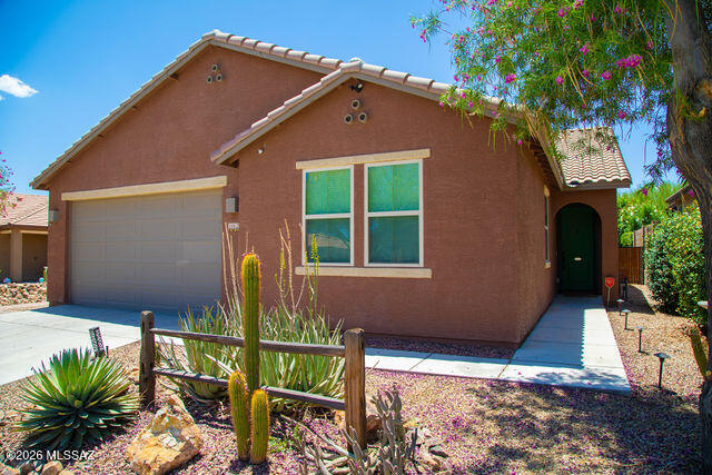 Welcome to this beautifully designed home nestled in the heart of Marana where comfort and space come together effortlessly. The stunning kitchen serves as the centerpiece of the home with plenty of space for gatherings, hosting, and creating memorable meals with family and friends. With 3 generously sized bedrooms plus a large versatile flex room, you'll have endless possibilities for a movie theater, game room, home gym, playroom, or additional entertaining space. When you step outside to the backyard oasis, take in breathtaking mountain views while relaxing in the hot tub. This is the perfect way to unwind at the end of the day. Conveniently located this home offers the ideal combination of peaceful living and community convenience.