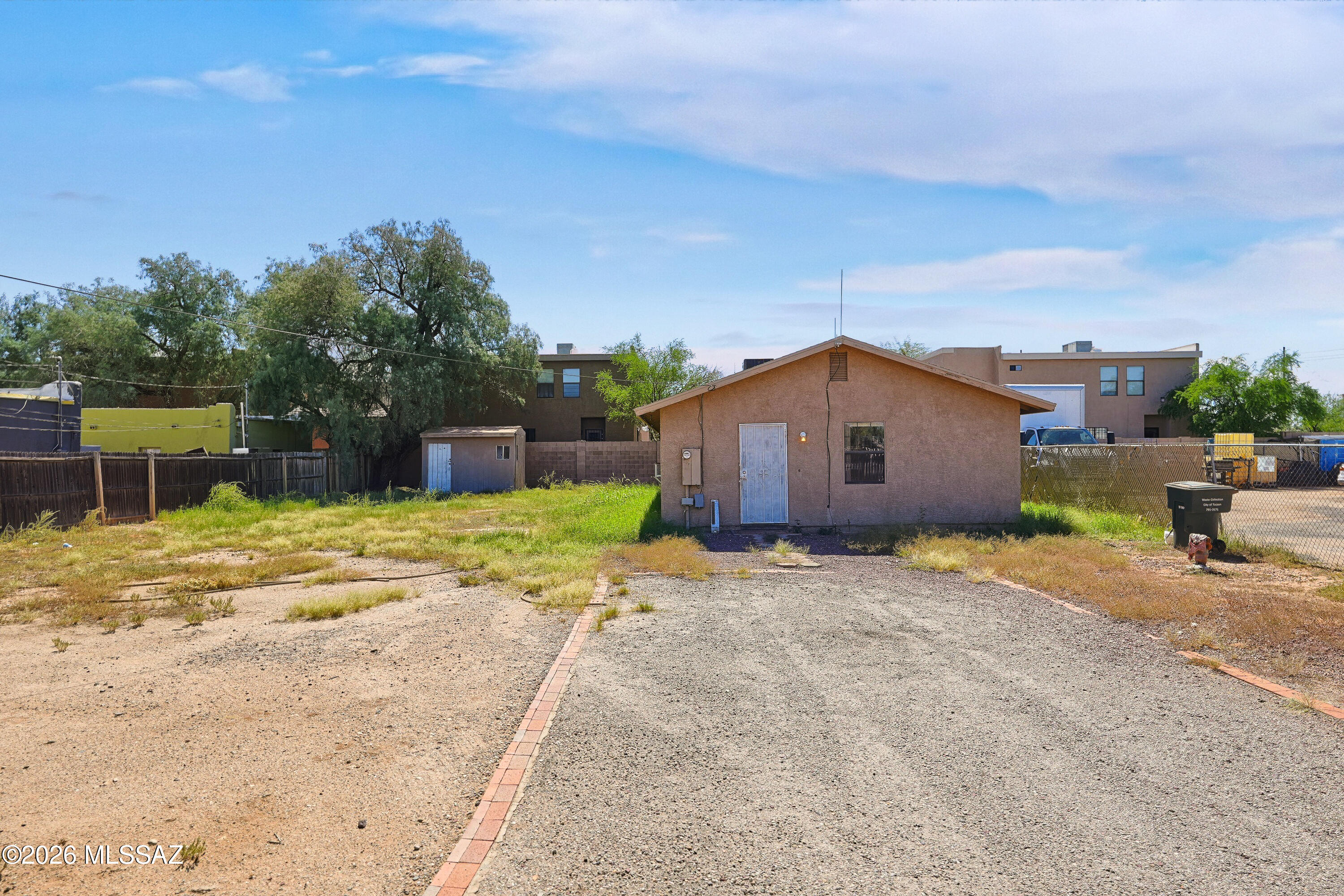 2-bedroom, 2-bath bungalow in Coronado Heights! This home offers tile flooring throughout and a spacious family room perfect for relaxing or entertaining. The kitchen features modern conveniences with an eat in kitchen. Sitting on a large 0.21-acre lot, the property is completely fenced with both chain link and wood fencing, providing privacy and security. Enjoy the convenience of a shed for extra storage and room for RV parking. Located in central Tucson, close to shopping, dining, and schools.