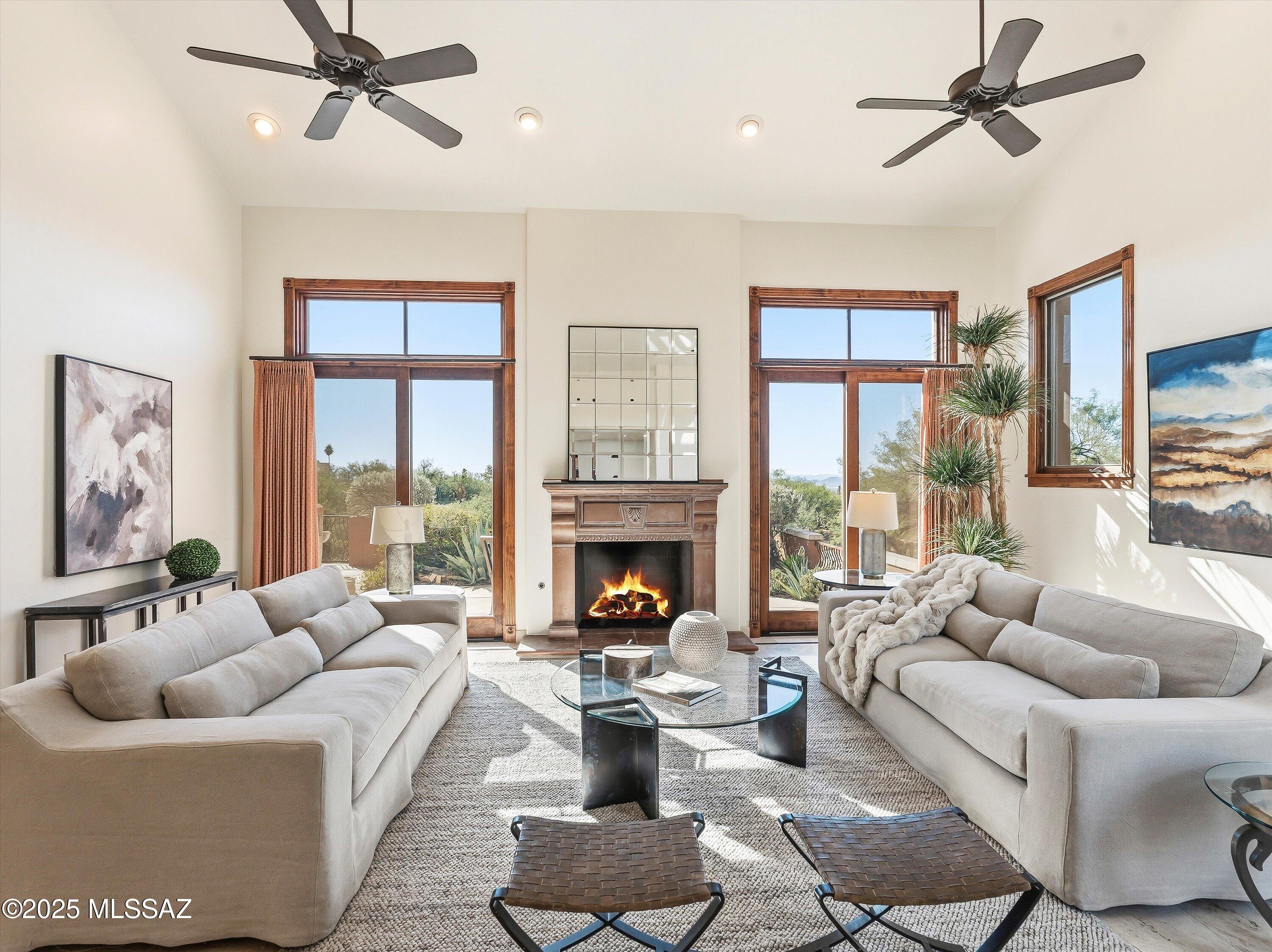 Skyline Country Club Estates. Positioned on a premier 1.14 acre corner lot, this estate captures the essence of the Mediterranean with a modern touch. The home boasts cathedral ceilings and Travertine floors, while 8-ft solid wood doors and custom wrought iron reflect a commitment to timeless craftsmanship. The floor plan is masterfully designed featuring three dedicated bedroom suites and a versatile media/theater room or den. The chef's kitchen is the heart for entertaining. The elevated lot offers a rare canvas for enjoying the tranquil courtyard or envisioning a custom infinity-edge pool just outside your private patio. Optional Club membership provides access to world-class golf and exclusive amenities just moments away. See Documents . Visit Skyline Country Club website.
Skyline Country Club offers an array of premium amenities designed for active, social lifestyles amid stunning Catalina Mountain views.
Golf: An 18-hole, par-71 championship course at 3,600 feet elevation, surrounded by desert flora and wildlife, challenges all skill levels. Includes a driving range, putting/chipping greens, and on-course training.
Fitness & Wellness: State-of-the-art center with cardio machines, free weights, and strength equipment. Group classes like yoga and dynamic sessions; personal training; spa services including massages, and facials. Wellness events
and challenges.
Aquatics: Heated, resort-style Olympic-sized pool for laps or lounging, with poolside dining and sunset views.
Tennis & Pickleball: Dedicated courts for leagues, tournaments, and casual play.
Dining & Events: Clubhouse options from casual to fine dining with local, seasonal menus; outdoor terraces. Versatile spaces for weddings, socials, and gatherings.
Membership provides exclusive access to these facilities, fostering community in a gated setting.
