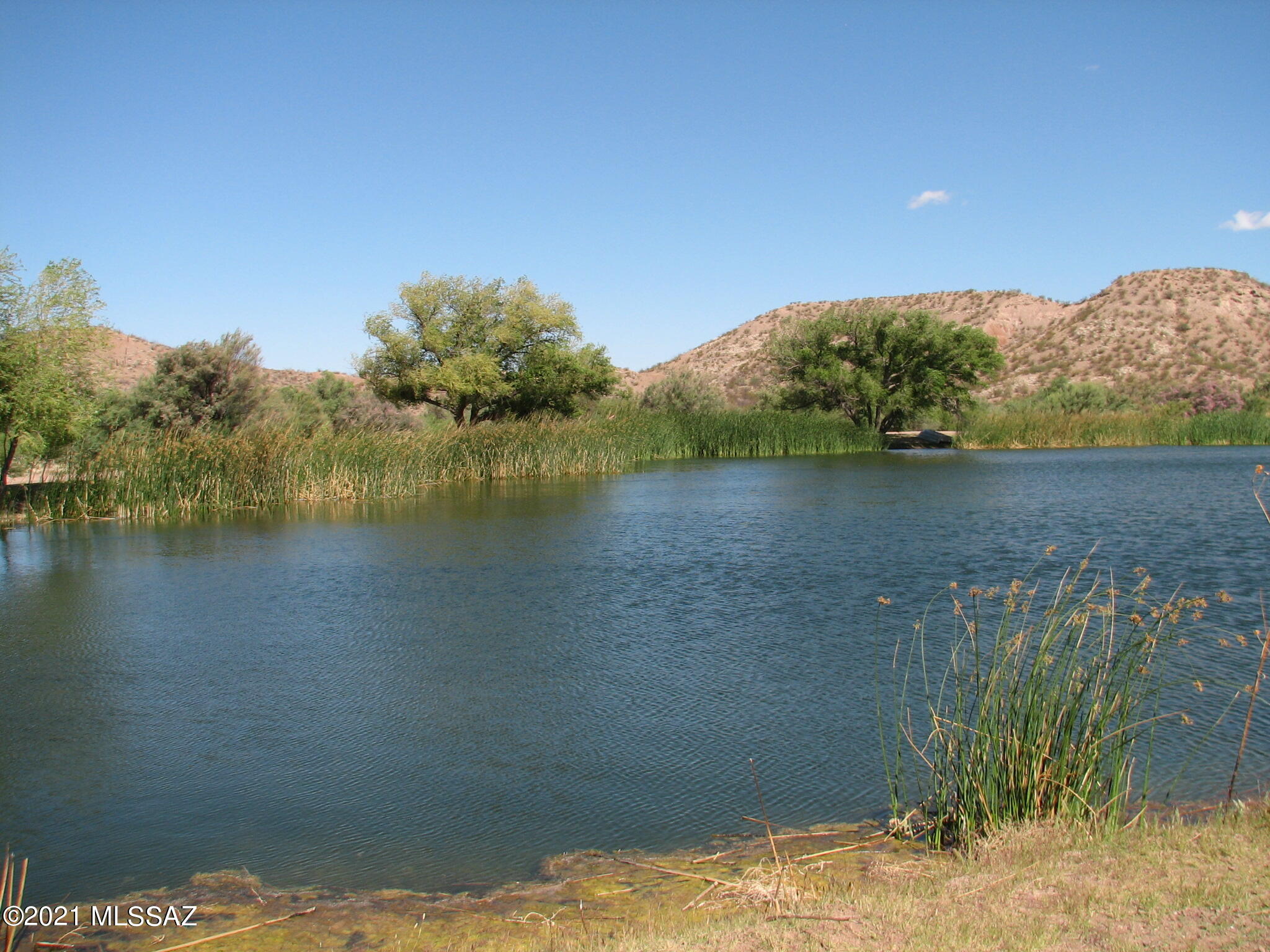 This versatile 44 Acres has an Special Use Air Strip, fully Permited for private planes, borders common area with  gorgeous community lake, has loads of native trees and vegetation.   Perfect home site for a pilot or family that loves to play at the lake !
Views galore, mountain, valley, sunsets, sunrises. Gated Community for privacy.  
See map in documents tab. 4 tax codes comprise the parcel
Agents:  Please read Agent Remarks.