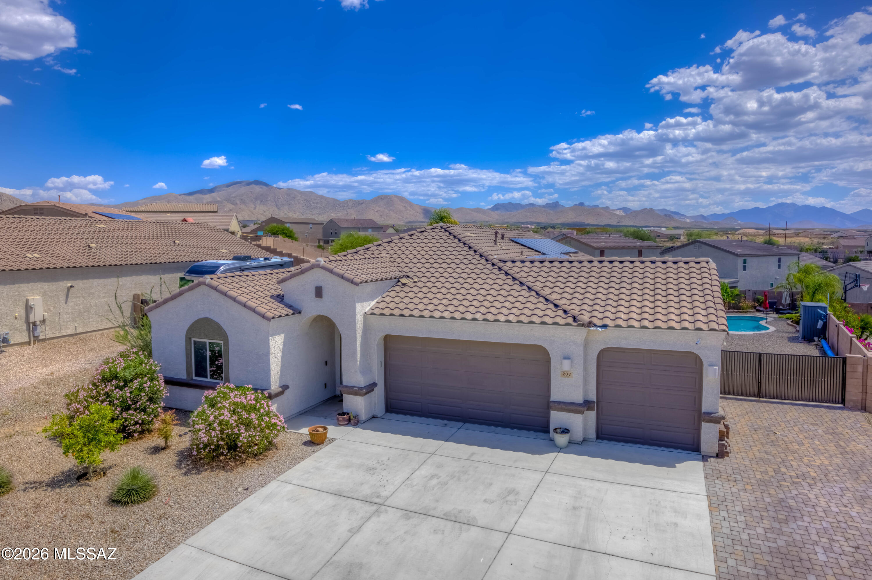 This beautifully upgraded home features 3 bedrooms, 2.5 bathrooms, and 2 versatile bonus rooms currently used as an office and workout space. These flexible rooms can easily function as a 4th and 5th bedroom, formal dining room, playroom, craft room, or additional living space to fit your needs. The oversized 3 car garage includes 8 foot garage doors, perfect for lifted trucks and larger vehicles, along with epoxy coated floors for a clean finished look. From the moment you walk through the front entrance, the custom wood accent wall creates a warm and inviting feel. The kitchen is thoughtfully designed with a spacious island, stacked stone tile backsplash, stainless steel honeycomb sink with glass rinse, reverse osmosis system, and stylish cabinet hardware. The dining area is generously sized and opens to an expansive living room featuring built in storage and an electric fireplace. 

The split floor plan provides privacy, with 2 well proportioned guest bedrooms and a full hall bathroom on one side of the home. The primary suite is exceptionally spacious and includes an oversized walk in closet. The primary bathroom features a walk in shower, double vanity, and substantial linen storage.

The laundry room is equipped with cabinet storage, folding counter space, and hookups for either a gas or electric dryer, including space for a stacked washer and dryer setup.

Step outside to a backyard designed for entertaining and relaxation with an extended paver patio, louvered pergola for additional shade, sparkling pool with travertine cool decking, and 2 storage sheds. The double gate entrance provides easy access to the side yard with room to park an RV, boat, trailer, or outdoor toys.

To top it all off, the solar system will be paid off at closing, providing added value and energy savings for the new owner. Homes with this combination of upgrades, functionality, and outdoor amenities are highly sought after in the area.