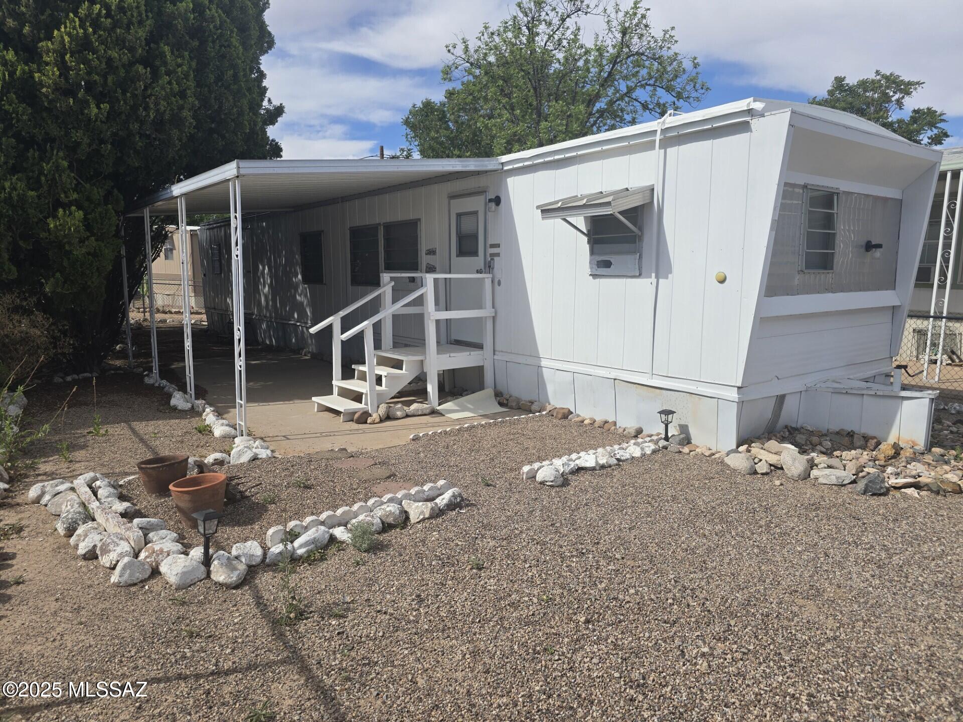 ADORABLE two-bedroom, one bath conveniently located close to shopping, restaurants, medical services, etc. Recently leveled, fresh paint, new doors, carpet and range. Price is for home only in 55+ Park, with $387.00 monthly lot rent. Buyer must apply to Stage Coach Trail MH Community to rent lot.