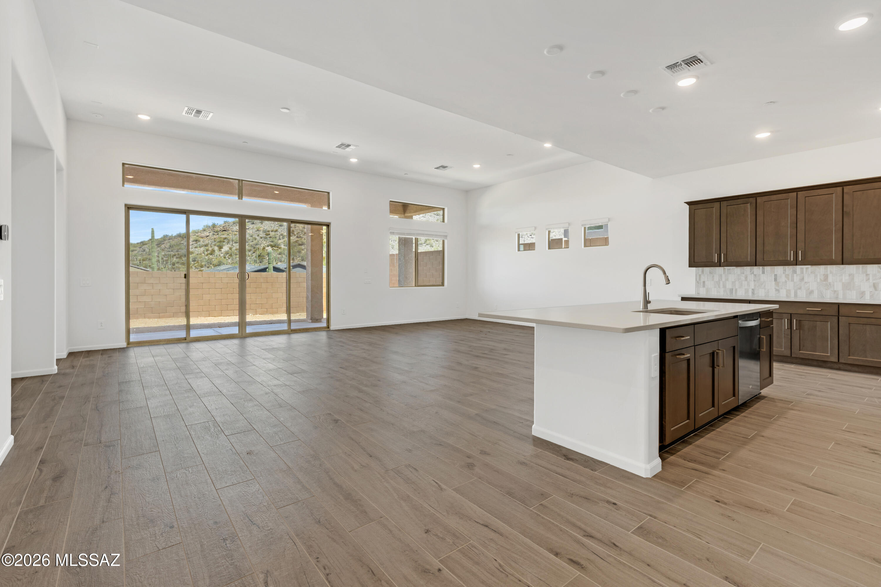 Oxford plan with Ranch elevation. This thoughtfully designed layout includes an open Greatroom area with spacious kitchen & dining area. Convenient Stop-n-Drop area just in from the 4-car tandem garage for organization & a place to charge your devices. The Owner's suite is a retreat with a huge walk-in closet, a beautifully tiled walk-in shower, and dual vanities & linen closet. The modern Gourmet kitchen is equipped with a gas cooktop, refrigerator, center island and a walk-in corner pantry for all your culinary needs. Enclosed study provides extra room for studying, hobbies and more. Laundry room is complete with Washer/Dryer. Includes 2'' faux wood blinds.