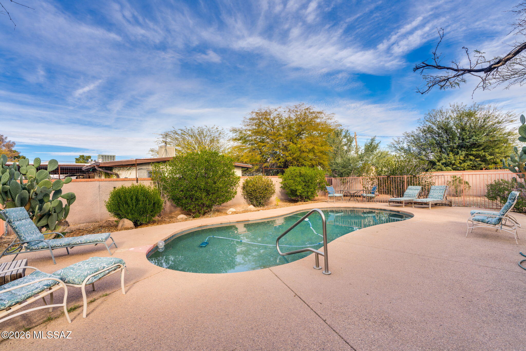 Exceptional Multi-Generational Living + Proven Income Opportunity in Central Tucson! Welcome to  a rare and versatile desert retreat located in the desirable Richland Heights area of Tucson. Designed for flexibility and lifestyle, this unique property features three private living spaces, making it ideal for multi-generational living, extended family, or a high-performing short-term rental investment. The main residence (1,778 sq ft) offers 3 bedrooms and 2 bathrooms, highlighted by a warm and inviting great room with vaulted ceilings, a cozy fireplace, and a beautifully styled Southwest kitchen that captures the essence of Tucson living. The attached guest quarters (1,086 sq ft) provide 2 bedrooms and 1& 1/2 bath, complete with charming wood beam ceilings and a cozy wood-burning fireplace A separate studio casita (518 sq ft) adds even more flexibility, featuring its own kitchenette with electric stove. This is ideal for guests, rental income, or private workspace. Step outside to your own desert sanctuary--complete with a pebble tec pool, expansive entertaining patio, natural desert landscaping, and breathtaking mountain views. The oversized lot is fully enclosed with block wall construction, offering exceptional privacy and a peaceful, secluded feel. No HOA provides added freedom, while the property's established $40,000/year average rental income makes it a standout opportunity for investors or owner-occupants looking to offset their mortgage. Perfectly located near the University of Arizona, The Loop trail system, and St. Philip's Plaza, you'll enjoy easy access to dining, nightlife, farmers markets, parks, medical facilities, and major commuting routes including I-10. Nearby "Winterhaven" adds seasonal charm with its beloved Festival of Lights tradition. A truly rare find that is offering lifestyle, income, and flexibility all in one. Very low solar loan, and the electric utility costs are so low! Nicely sized fully organic garden with irrigation.
Do not miss out on this retreat.
see full media available at this link:  https://media.hausphotoco.com/sites/xaqklne/unbranded