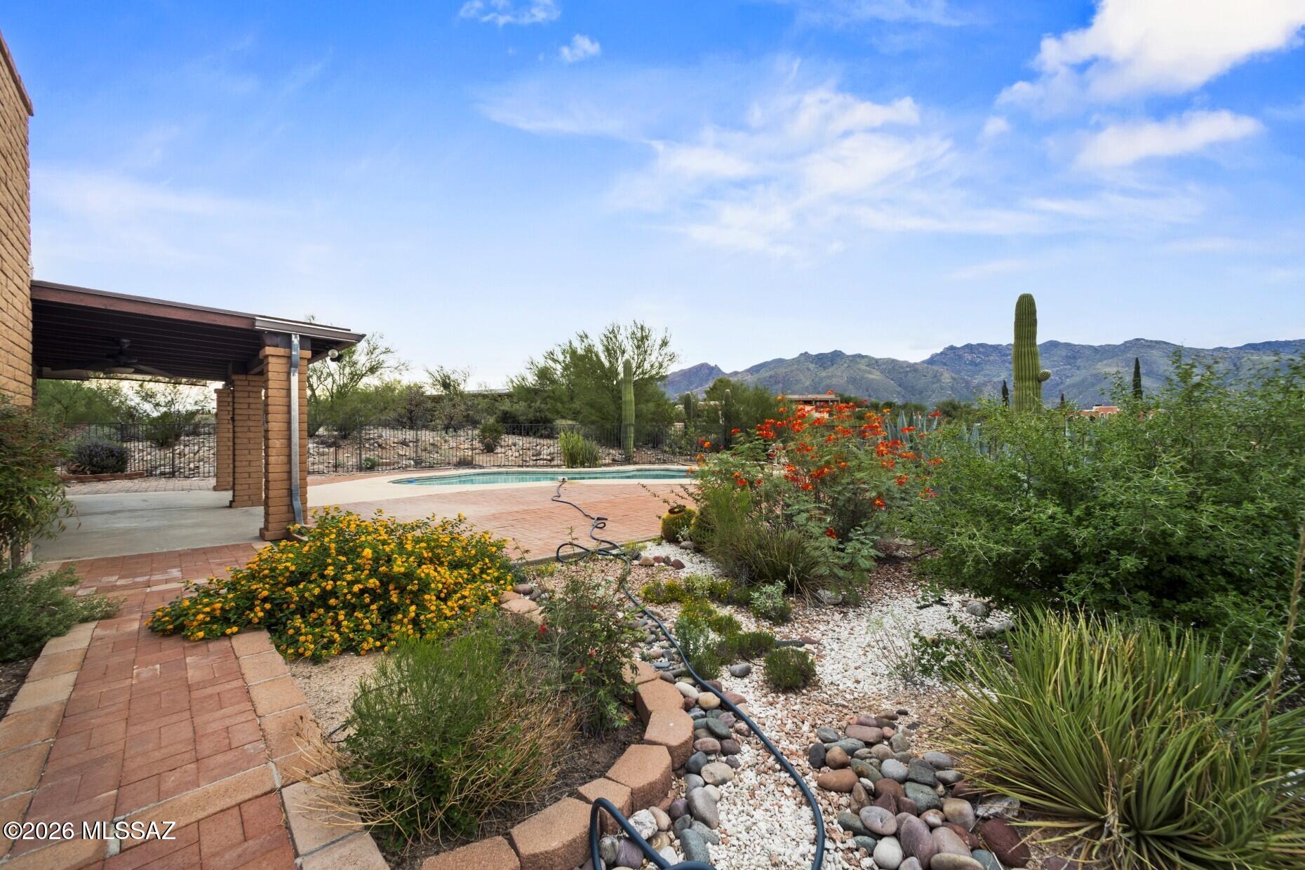 If you are looking for drop dead gorgeous views, this Heatherwood Hills property is the home for you. Back patio panoramic views are spectacular as are the views from the front of the home. This home was built in 1977 and has had only 1 owner.  Floor plan is very functional with good size living room plus dining area. Kitchen opens to a large fanily room with woodburning fireplace and French doors to the covered patio and pool with lush desert landscaping.  The home features 4 bedrooms & 2 baths. The kitchen has stainless steel appliances, granite counters and lots of storage. Laundry also features additional storage cabinets. The HVAC unit is approximatey 4 years old. Roof was replaced about 6 years agao.  This is an estate sale.