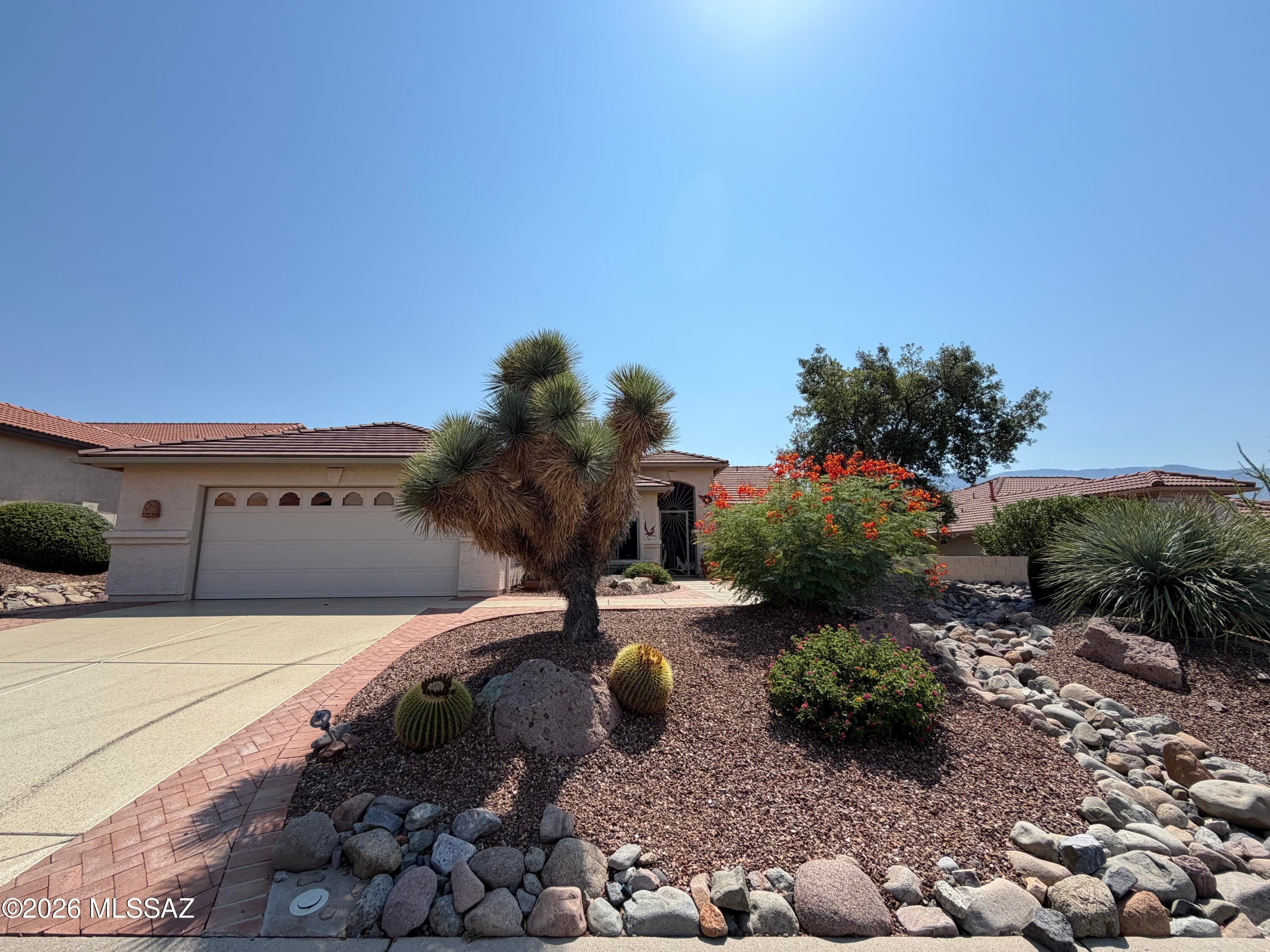 Breathtaking Views & Southwest Charm! This beautifully appointed Laredo model offers stunning views from its elevated, east-facing backyard and from nearly every room. Featuring 2 bedrooms, 2 bathrooms, and a den, this home combines comfortable living with classic Southwest-inspired décor. 
The open-concept floor plan features a spacious kitchen with a large island, generous cabinetry, and a convenient dining area, while the split-bedroom design provides privacy for family and guests. Step outside to enjoy the spectacular scenery from the extended covered patio, complete with a built-in BBQ--perfect for relaxing or entertaining. A welcoming front courtyard provides an additional outdoor living space. 
The extended garage offers plenty of room for vehicles, hobbies, and storage, with an abundance of built-in storage cabinets to keep everything organized. Additional updates include roof underlayment replaced July 2026 and a 2019 water heater. A wonderful opportunity to enjoy beautiful views, inviting indoor-outdoor living, and the distinctive charm of the Laredo model.