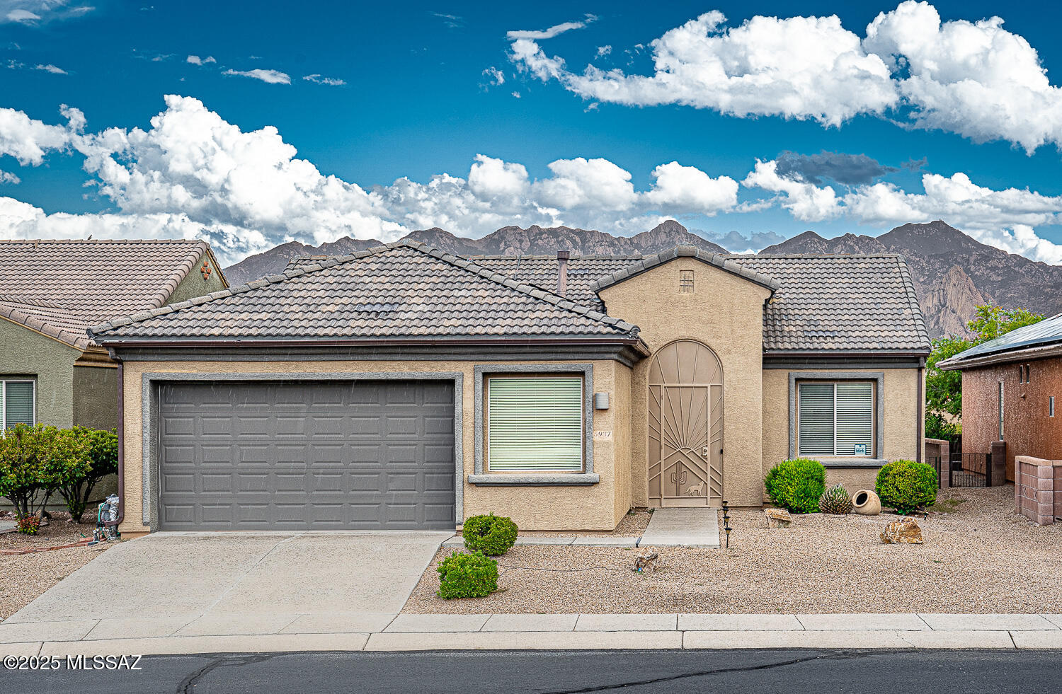 Excellent opportunity in this gated community.  Great room floor plan with peek a boo mountain views.  Raised panel oak cabinets, recessed lighting, dining/flex room, security screen doors in both front and back. Garage has overhead storage and an area for a workshop. Roof replaced 2023, owned solar, newer refrigerator, water heater.  All furniture and furnishings available under separate bill of sale.