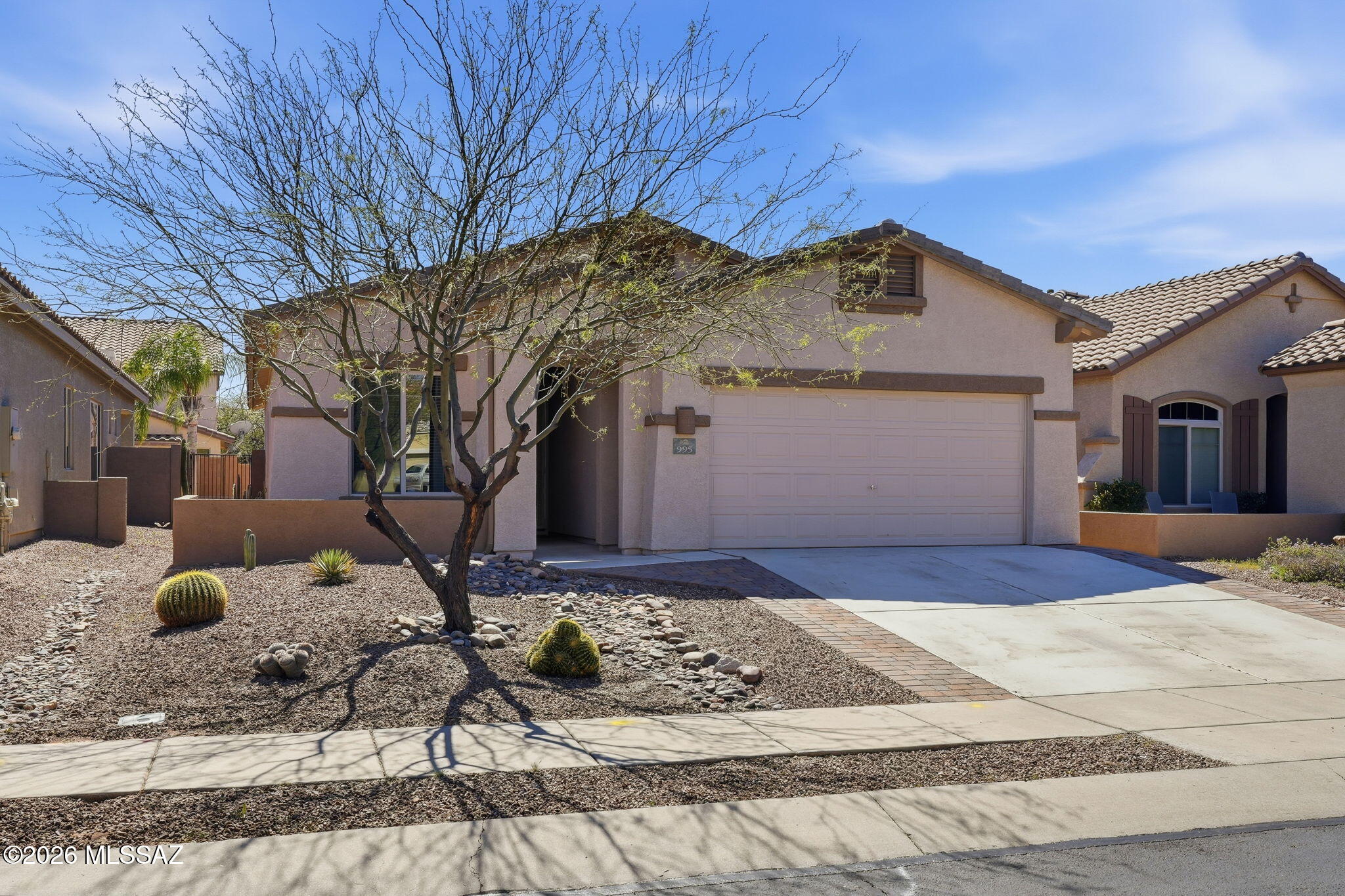 Beautiful, upgraded, Pulte built, 3Br plus den/office home tucked away on a quiet cul-de-sac street in the La Terraza neighborhood of Rancho Vistoso. Inviting courtyard entry. Completely tiled throughout (no carpet). Large, open kitchen with abundant maple cabinetry, granite counter tops, breakfast bar, pantry, stainless steel appliances including a gas range, new microwave and near new dishwasher, removable buffet cabinet. Large office/den area could easily be 4th bedroom. Nice upgrades include a gas fireplace, Kinetico water softener and reverse osmosis system and a screened in rear patio. Refrigerator, washer and dryer included. Ceiling fans throughout. Short walk to Hohokam Park with tennis courts, dog park, playground and Innovation Academy. Seller willing to carry. Terms negotiable.