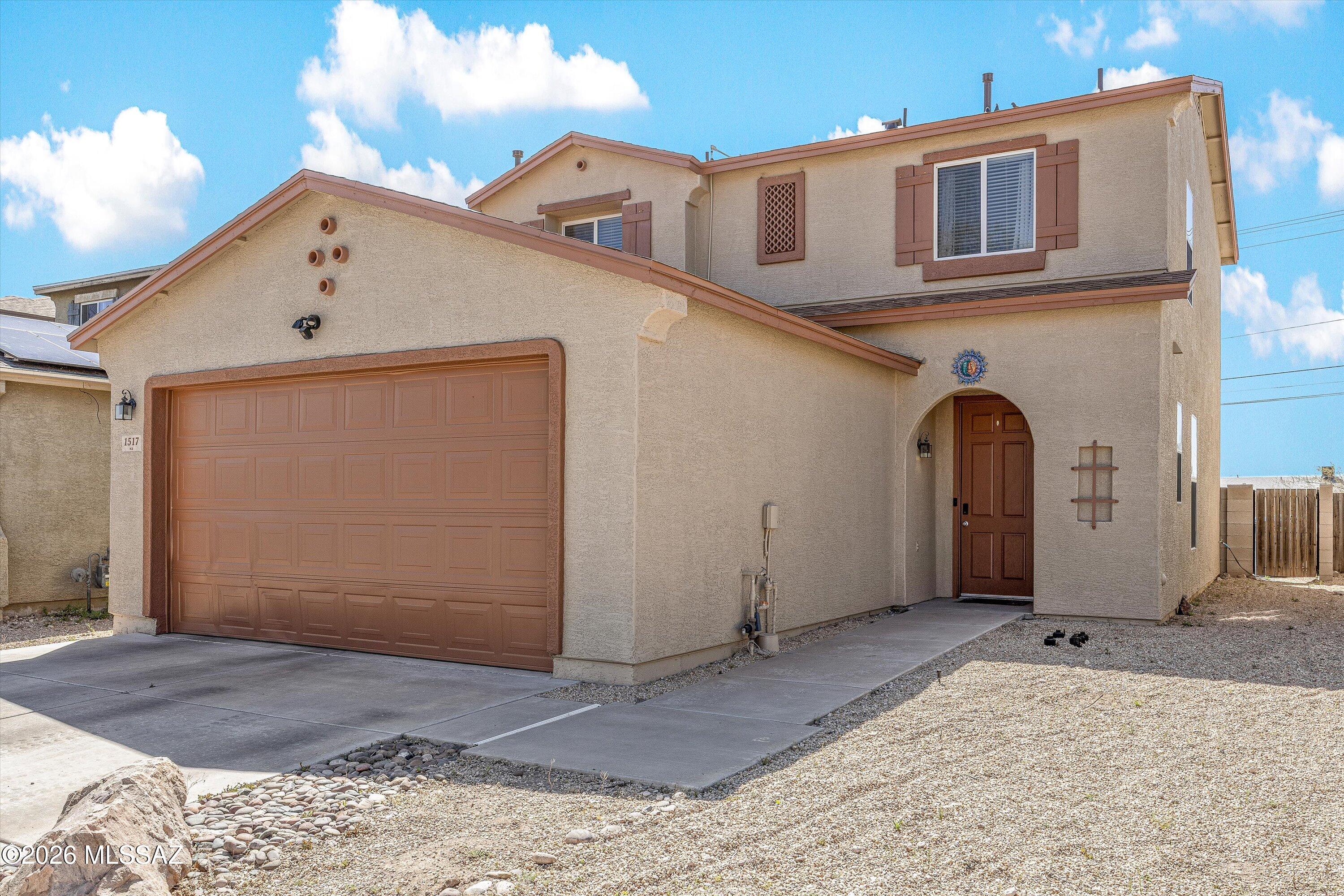 Seller willing to offer a credit towards solar lease payoff with an accepted offer.Beautiful two-story home featuring 3 bedrooms and 2.5 bathrooms, offering an inviting layout.The main level provides a comfortable living space with an open flow, perfect for both everyday living and entertaining. The kitchen offers ample cabinetry space, connecting seamlessly to the dining and living areas. Upstairs, youll find all three bedrooms, including a spacious primary suite with a private bathroom and closet space.The additional bedrooms are well-sized and offer flexibility for family, guests, or a home office. Enjoy nearby parks and outdoor amenities, like A Mountain and the Loop, perfect for biking, and walking. Conveniently located just minutes from Tucson Starr Pass Resort & Spa, Downtown Tucson and the University of Arizona, offering easy access to shopping, and dining.