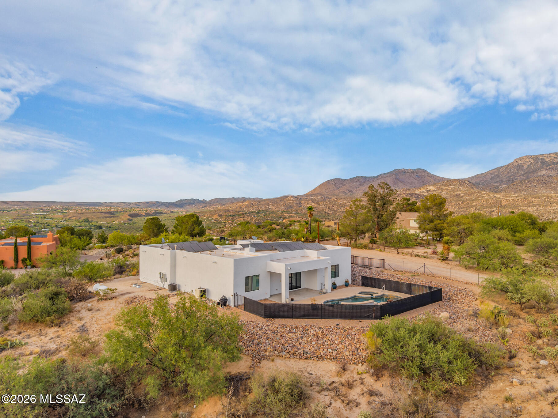 Experience a true one-of-one masterpiece at the base of the majestic Catalina Mountains. This custom-built 2018 estate blends timeless architecture with luxurious modern updates, creating an extraordinary retreat unlike any other. Soaring ceilings, expansive windows, and breathtaking mountain views surround you from nearly every room, filling the home with natural light. Designer finishes, refined craftsmanship, and thoughtfully curated details elevate every space. Step outside to your private backyard oasis featuring a sparkling pool, mature desert landscaping, and panoramic vistas that capture the beauty of Southern Arizona. A rare opportunity to own an iconic home where history, elegance, and the Catalina lifestyle come together.