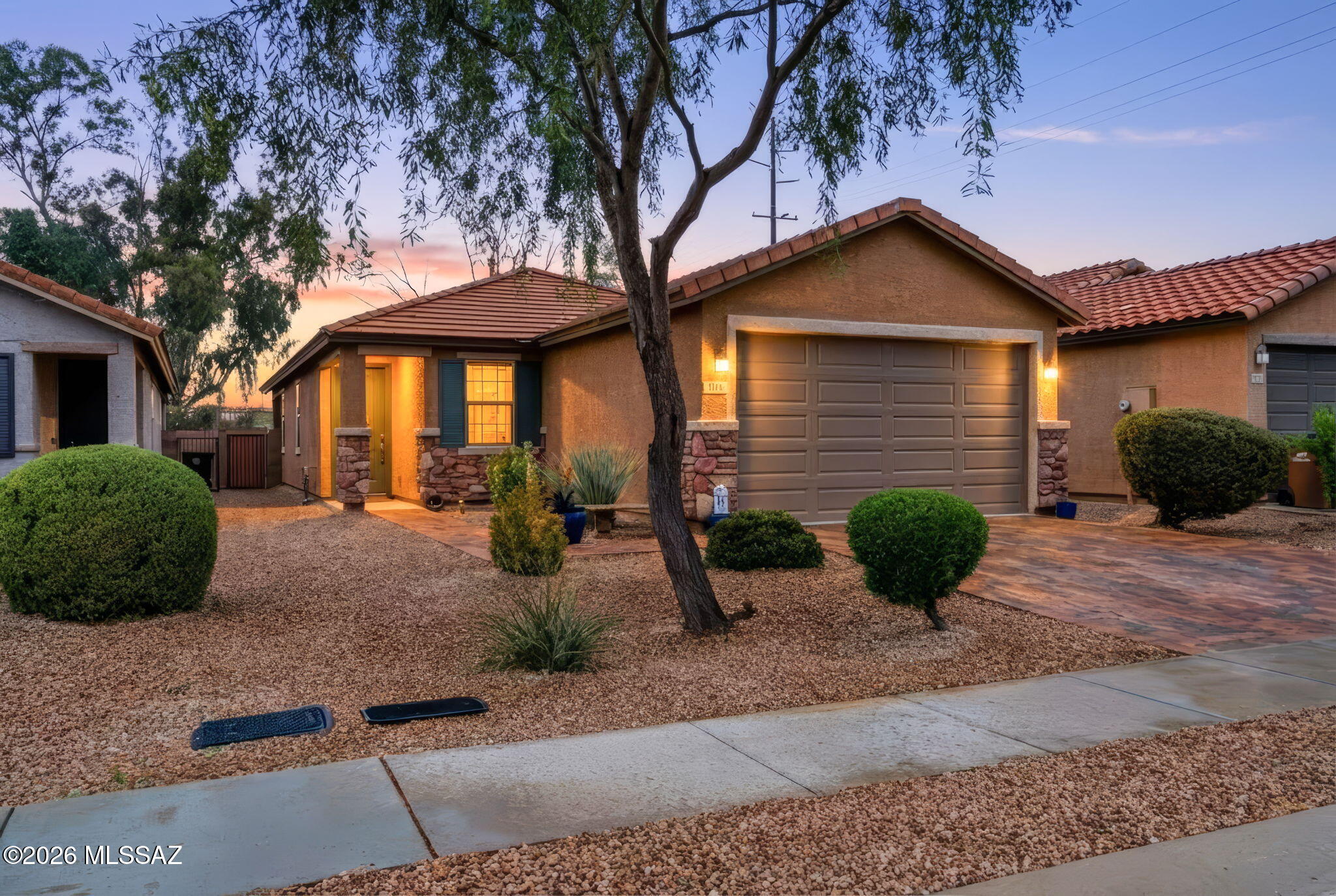 Tucked away in a gated Northwest Tucson community, this beautifully maintained 3-bed, 2-bath home sits on a quiet cul-de-sac and checks every box. At 1,465 sq ft and built in 2018, the open floor plan feels bright and spacious from the moment you walk in. No rear neighbors means real privacy, and the stunning mountain views give you that classic Tucson backdrop every single day. Steps from the golf course, fine dining, and premier shopping -- this is the lifestyle you've been looking for, now at an even better price. Don't miss your chance to make it yours.