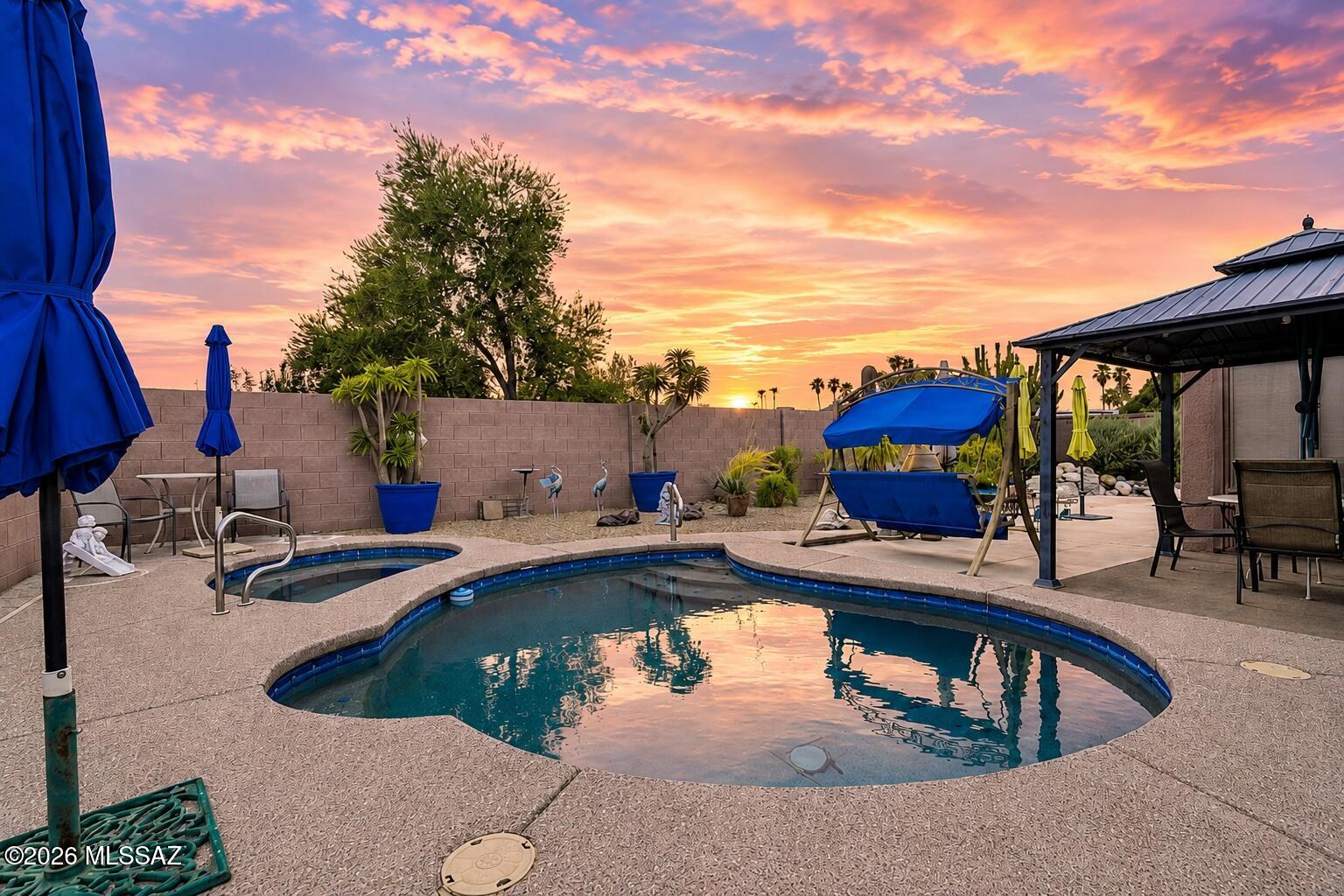 Range-priced: Seller will accept or counter offers between $364,888 and $379,888. Seller may also consider contributing to a portion of the solar loan with an acceptable offer. Welcome to 7861 N Roundstone Drive, a unique 3-bedroom, 2-bathroom tri-level home situated on a desirable corner lot with mature landscaping and plenty of Arizona charm. The inviting gated front patio and wrought-iron security door creates a cozy entrance and the perfect place to enjoy your morning coffee, Diet Coke or other favorite beverage --while watching the sunrise and taking in the mountain views. Inside, the tri-level floor plan offers comfortable separation between living spaces, while the Arizona room provides valuable additional space for relaxing, entertaining, hobbies, a home office, or whatever best fits your lifestyle. The backyard is ready for year-round enjoyment with an in-ground PebbleTec pool featuring a self-cleaning system. The pool was recently refinished, allowing you to spend more time swimming and less time worrying about maintenance. After a swim, unwind in the private sauna and enjoy your own relaxing retreat right at home. Additional peace of mind comes from a roof that is less than 2 years old. Conveniently located near dining, shopping, highway access, and the everyday conveniences you could want, this home offers a wonderful combination of character, comfort, location, and Arizona outdoor living. Homes with this much personality, convenience, and backyard appeal are hard to find--schedule your private showing today and come see everything 7861 N Roundstone Drive has to offer!