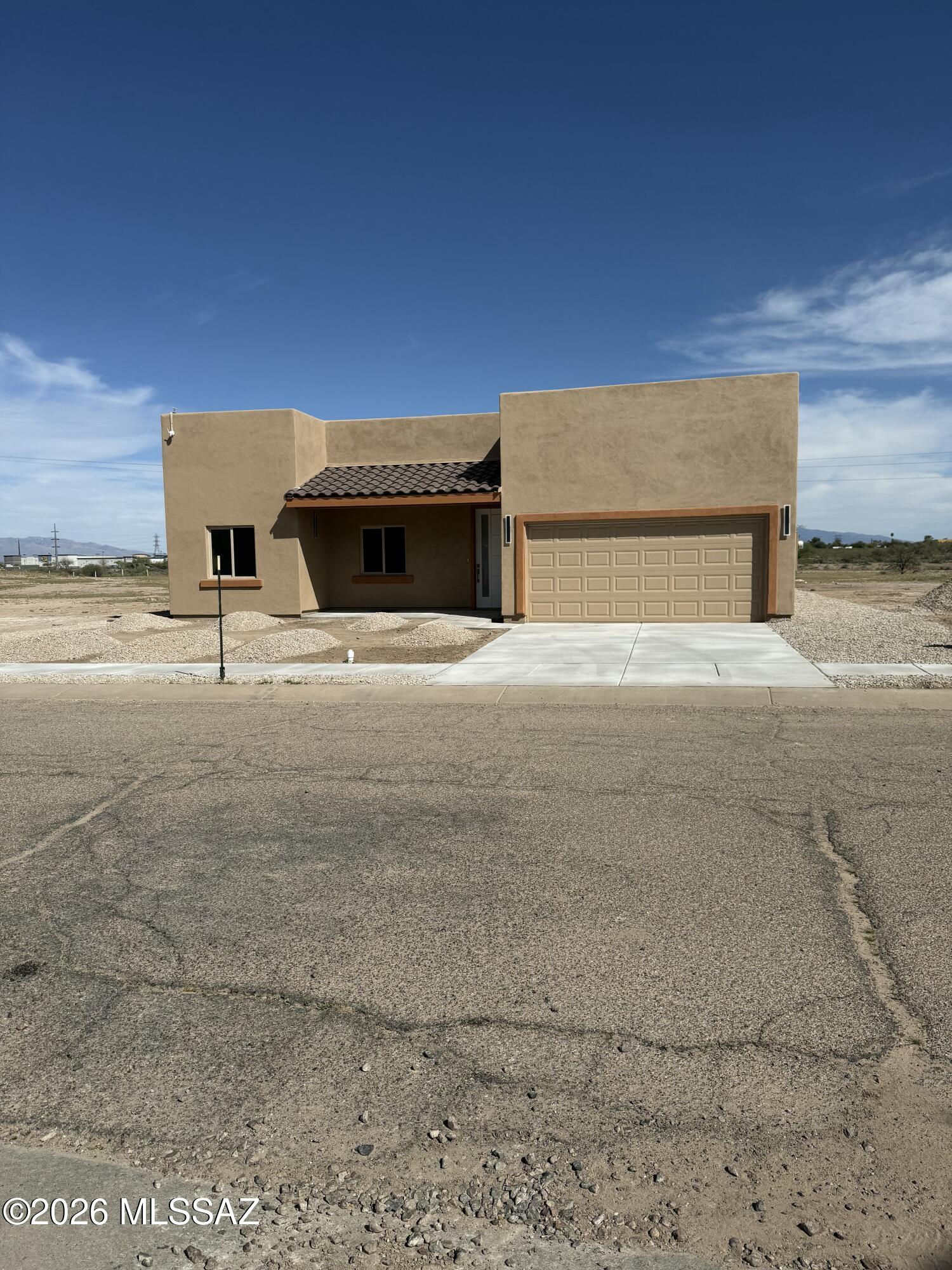 Welcome Home to this stunning new construction home scheduled to be completed September 2026. This thoughtfully designed layout with an open floor plan includes 9' ceilings & a split-bedroom design for added privacy. The spacious kitchen offers a large island & granite countertops, providing ample space for cooking and gathering. Both bathrooms include dual vanities and custom-tiled showers. Durable wood-look tile flooring runs throughout the home. A versatile game room offers additional space for entertaining, hobbies, or a home office. Situated on over a 1/4 acre, this generous sized lot includes low-maintenance landscaping & endless possibilities. A large two-car garage completes this well-appointed property. Come & take a look!