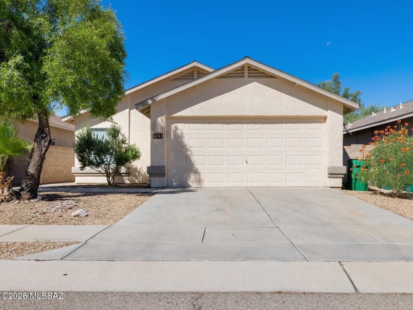 Start Homeownership with peace of mind and a brand new roof + closing credit! Welcome to this well-maintained single-story home in the Rillito at La Cholla community. Offering 3 bedrooms, 2 bathrooms, and 1,145 square feet, the home features an open, functional floor plan, laminate flooring, and a spacious primary suite with a walk-in closet. A washer and dryer are included for added convenience. The large, block-fenced backyard provides plenty of room to relax or entertain, while the covered patio and low-care landscaping make outdoor living easy. An attached two-car garage offers additional parking and storage. Ideally situated on Tucson's northwest side near Curtis Park, the Chuck Huckelberry Loop, Tucson Mall, Northwest Medical Center, shopping, dining, and convenient access to I-10
