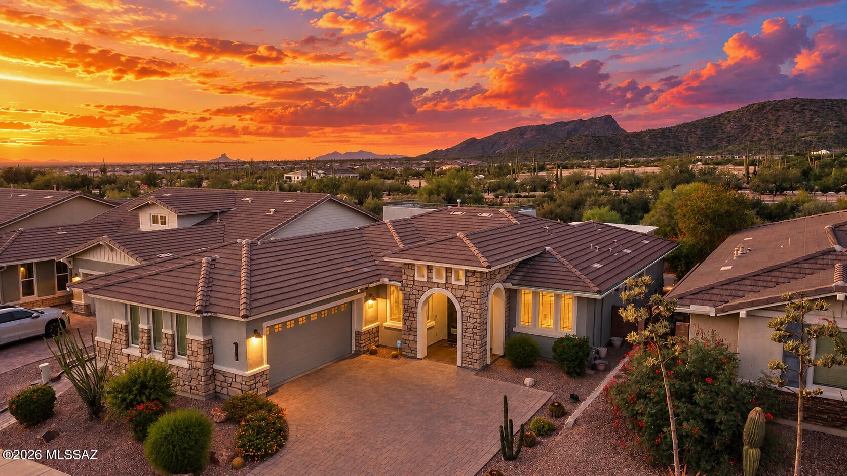 Buy this home with confidence! Seller put over $75K in additional upgrades since owning this lovely home. Fabulous mountain views with N/S orientation, great room floor plan with gourmet kitchen, staggered 42'' cherry cabinets, SS Whirlpool appliances, granite countertops w/glass mosaic backsplash, huge island, pantry, and formal dining area. Spacious Den with glass French doors brings an abundance of natural light. Primary ensuite with 2 closets, back patio access, large bath w/split vanity, granite counters, soaking tub & separate shower. Extended garage and extensive work done in the back patio. For that special WOW factor, enjoy the roof deck for incredible mountain views, sunsets and starry nights. Location is superb with minutes from hiking trails, Marana's Tortolita Preserve, parks, pickleball courts, and worlding class golf.