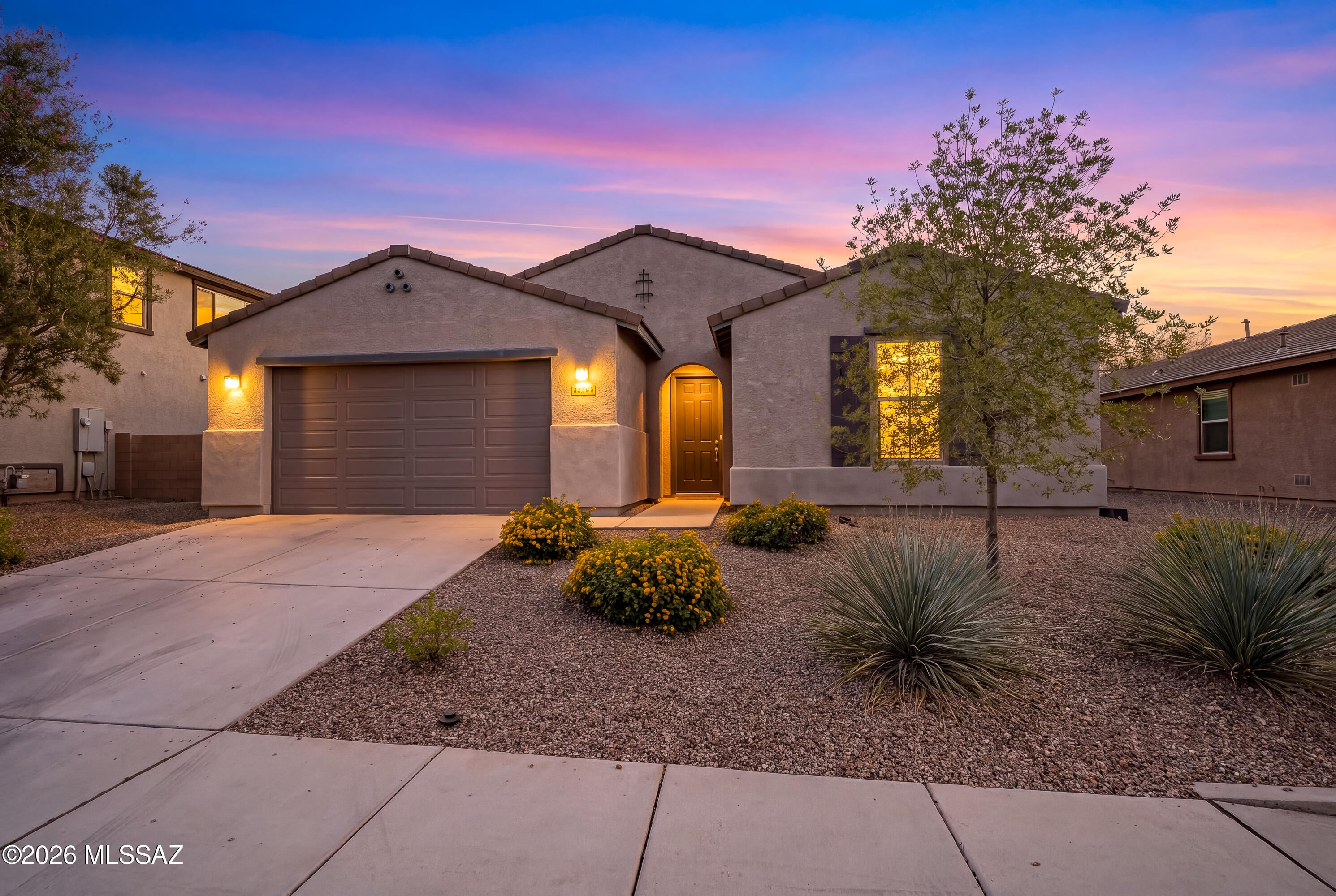 Local lender offering a one year buy down of the rate. Seller willing to offer additional $ towards buydown or concessions with acceptable offer. Look no further! 4-bedroom, 3-bath home is ideally located, backing to Heritage Park in Gladden Farms. Inside, you'll find plank ceramic tile flooring throughout the main living areas, with carpet in the bedrooms. Designed for both everyday living and entertaining, the spacious chef's kitchen features a large quartz island, gas cooktop, double ovens, microwave, and a butler's pantry with abundant storage. The generously sized primary suite is a true retreat, featuring two walk-in closets and a luxurious en-suite bathroom with an impressive walk-in shower complete with dual shower heads. Bedroom 2 and 3 share a Jack and Jill bathroom. Bedroom 4 has another adjacent bathroom. The laundry room incl. washer, gas dryer, sink and storage. Three-car tandem garage with a water softener andaccess door to back yard where you will find a covered patio, pavers and a gas stub. This exceptional home offers the best of community living in one of Marana's most sought-after neighborhoods, easy access to schools, trails, parks, shopping and the outstanding Marana Aquatic & Recreation Center.