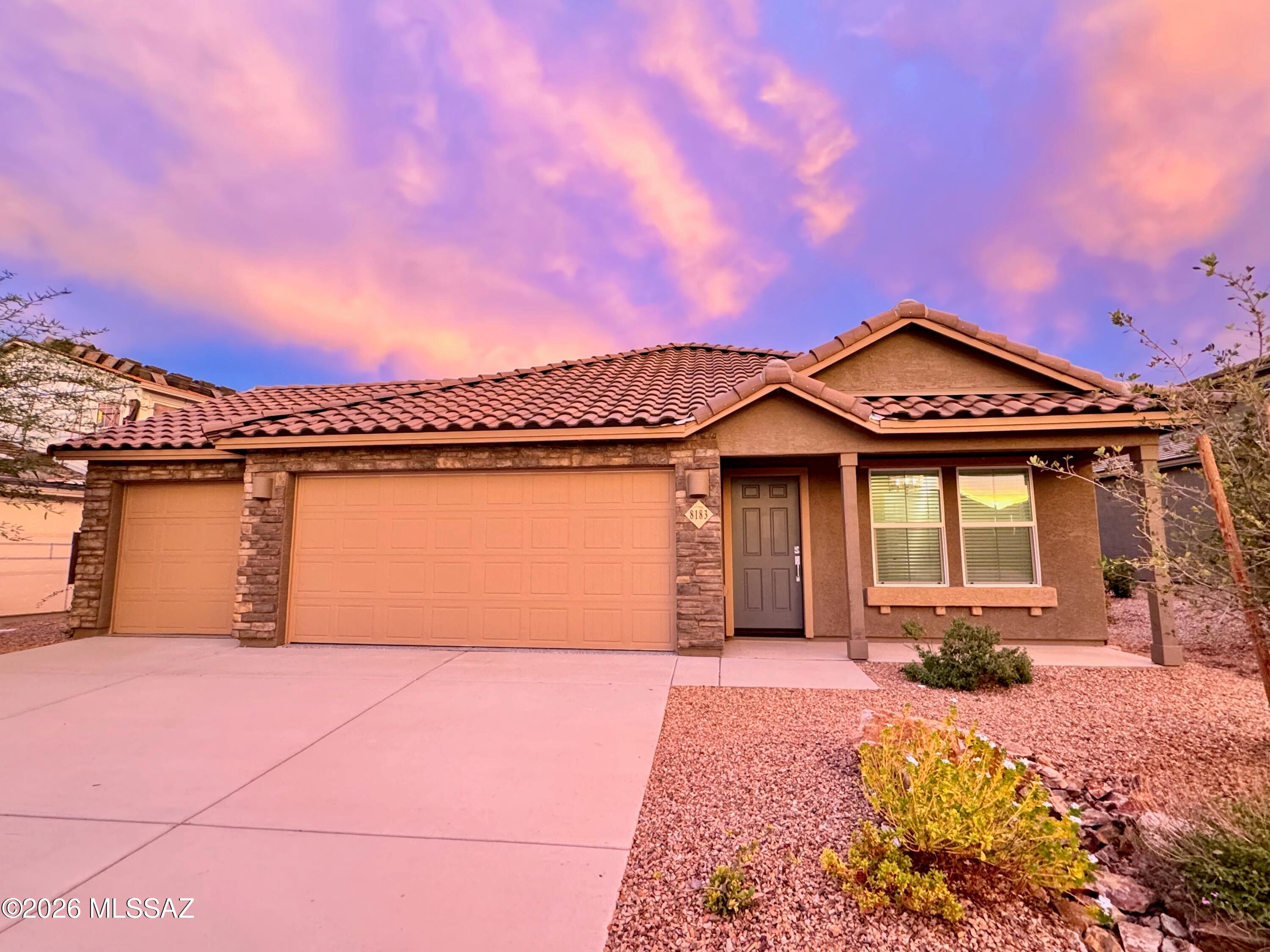 Stunning Lennar model home with breathtaking Rincon Mountain views in the highly sought-after Rocking K Ranch community! This beautifully upgraded 1,427 sq. ft. home offers 3 bedrooms, 2 baths, and a rare 3-car garage, combining style, functionality, and comfort. The thoughtfully designed open-concept floor plan features a spacious great room that seamlessly connects the living area, dining space, and gourmet kitchen--perfect for entertaining and everyday living. Designer upgrades throughout include striking tile accent walls, modern fixtures, and model-home-quality finishes that elevate every room.
Wake up to spectacular mountain views and enjoy the beauty of Southern Arizona right from your backyard. Located in the award-winning Vail School District, this home offers access to some of the area's top-rated schools. Residents of Rocking K Ranch enjoy exceptional community amenities, including a park with pickleball courts, basketball courts, playgrounds, and open green spaces. Outdoor enthusiasts will love the proximity to some of the region's best hiking and biking trails. This is a rare opportunity to own a professionally designed model home in one of Vail's premier master-planned communities!
