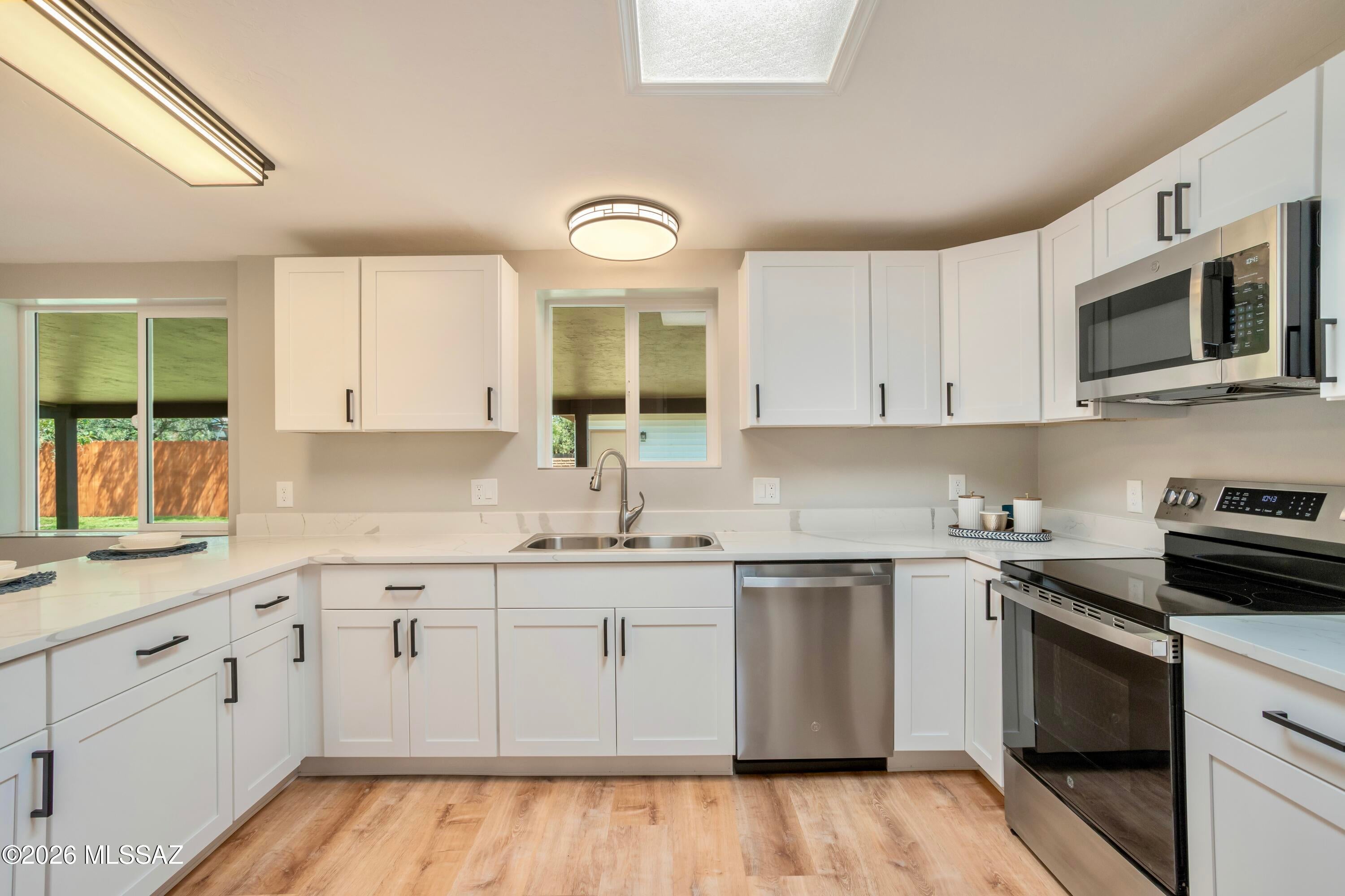 **Welcome to this beautifully renovated home, where thoughtful upgrades, high-end finishes, and modern safety improvements come together to create a truly move-in-ready property!** Completely renovated from top to bottom, this home offers the feel of new construction without the wait or hassle. Inside, you'll find 4 spacious bedrooms, 2 bathrooms, a stunning upgraded kitchen, dining area, and inviting living room featuring a charming beehive fireplace. Every detail has been thoughtfully considered, making this home as functional as it is beautiful. Step outside to a fully fenced backyard with a large covered patio overlooking the expansive yard. An additional detached building is fully heated and cooled, offering endless possibilities for a home office, guest space, hobby room, gym. etc workshop, or whatever fits your lifestyle. The patio also features a convenient kitchen sink, making it easy to create the ultimate outdoor BBQ and entertaining area.
The renovations are complete, the hard work is done, and all that's left to do is move in and enjoy! Come see everything this exceptional home has to offer!