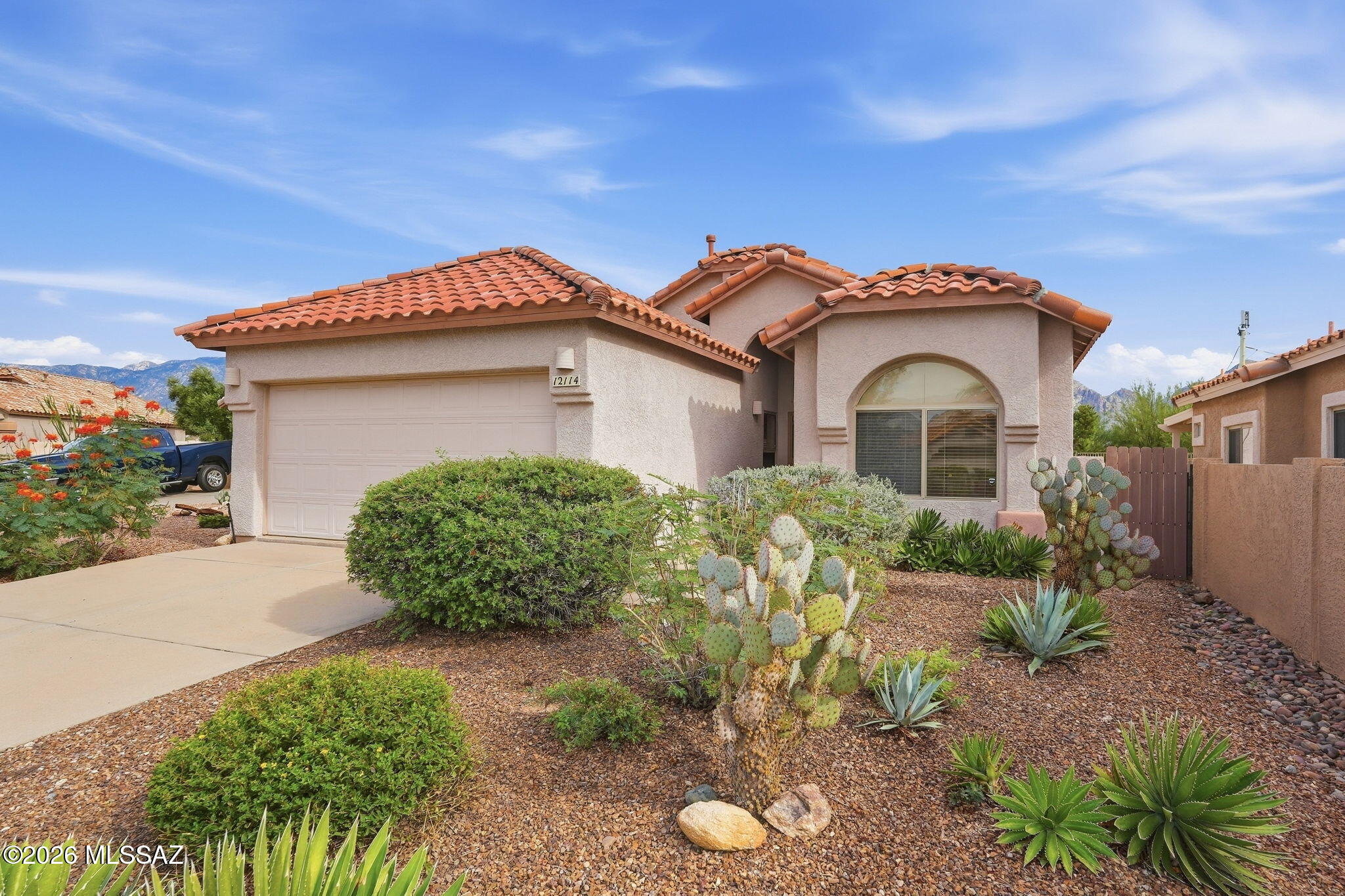 Welcome to 12114 N Jarren Canyon Way -- a single-story gem in the sought-after Overlook at Vistoso community of Rancho Vistoso! This well-maintained home offers stunning Catalina Mountain views from the backyard and Tortolita Mountain vistas from the front.

Inside, beautiful porcelain plank-style tile flows through the kitchen, nook, living room, and den. The kitchen features quartz countertops with pullout shelving, and the split-bedroom plan provides privacy and comfort. Bedroom 3, with double doors, makes a perfect office or den. The primary suite includes a dedicated mini-split cooling unit for year-round comfort.

The backyard is made for entertaining with two covered patios and an extended concrete pad. Low-maintenance landscaping on drip irrigation keeps it effortless. Enjoy nearby Wildlife Ridge Park and easy access to shopping, dining, medical, and outdoor recreation.

3 Bed | 2 Bath | 2-Car Garage | 1,369 Sq Ft | 5,924 Sq Ft Lot | Built 2000 | Tile Roof