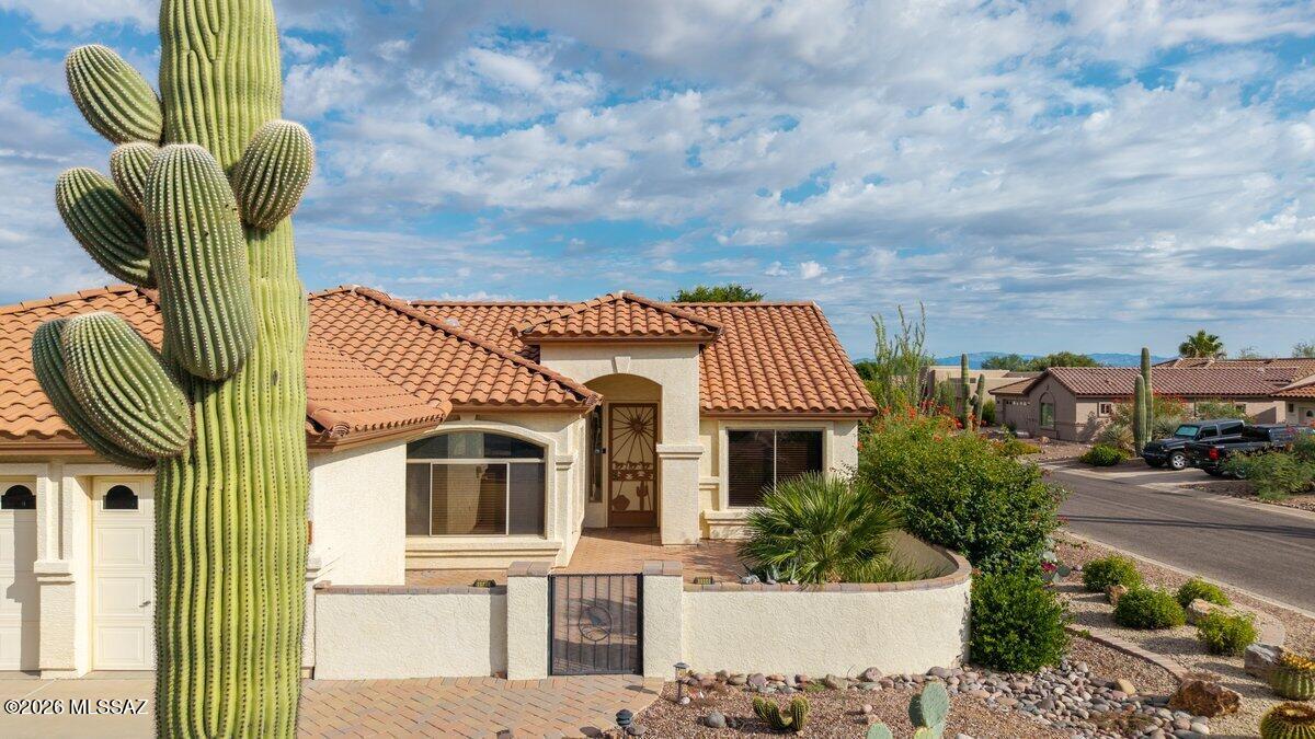 Located on a corner lot the Gated community of Quail Creek, this Laredo 2 bedroom, 2 bath home, built in 2003, boasts New Roof, New Carpet, New Paint, a Pool, Spa, 2.5 car garage, which can hold your motorcycle or golf cart. and Open floor plan. Split bedroom plan offers privacy for yourself and your guests. The kitchen features granite countertops, while the primary bath offers a beautifully tiled shower. There is a Murphy bed in secondary bedroom and a den. Built-in entertainment center with accent lighting. Extended covered patio is a great place to enjoy morning coffee or adult beverages with your friends and neighbors. Residents enjoy a wealth of amenities including on-site restaurants, golf, pickleball, tennis and more, making it the perfect blend of comfort and community living.