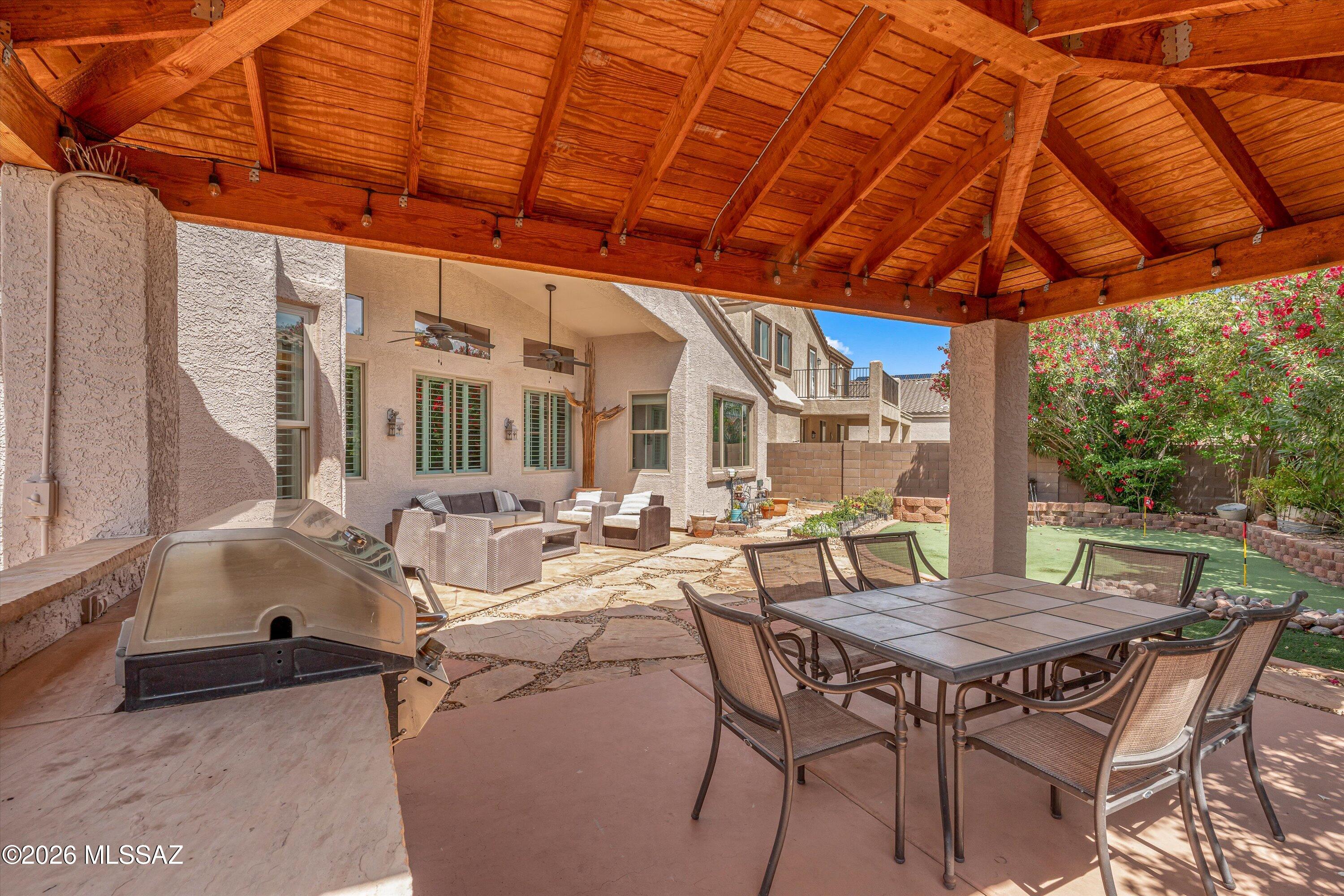 Experience the best of indoor-outdoor living in this 4BD/2BA Rancho Vistoso home. The incredible backyard features mature landscaping, a turf putting green, covered patio with ceiling fans, and a 200 sq ft tile-roof ramada with built-in BBQ -- creating exceptional space for relaxing and entertaining. Inside, enjoy Pella windows and doors, reverse osmosis water filtration, and no poly pipes. A newer roof (Dec. 2019) and solar help keep utility costs low. Complete with a 2-car garage and conveniently located near excellent parks and top-rated schools, this home offers comfort, efficiency, and the ideal Oro Valley lifestyle.

Solar system is currently leased, and seller is willing to pay off the lease with a strong offer.