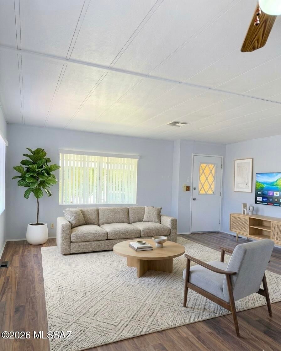 Welcome to this updated where it costs 2 bedroom 2 bath home located in a desirable gated 55+ resort style community.Featuring NO CARPET throughout this home offers comfortable low-maintenance living with updates where they matter most including PEX plumbing, HVAC, water heater and heater. The HVAC is approximately 5 years old. The kitchen features NEW stainless steel appliances, while the spacious covered patio and  backyard provide the perfect setting for relaxing or entertaining. Enjoy an active resort lifestyle with an impressive selection of amenities including billiards, cards, fitness center, bocce ball, pitch & putt course, BBQ areas, library, lounge and more. Move-in ready and waiting for you to enjoy Arizona living at its best!
