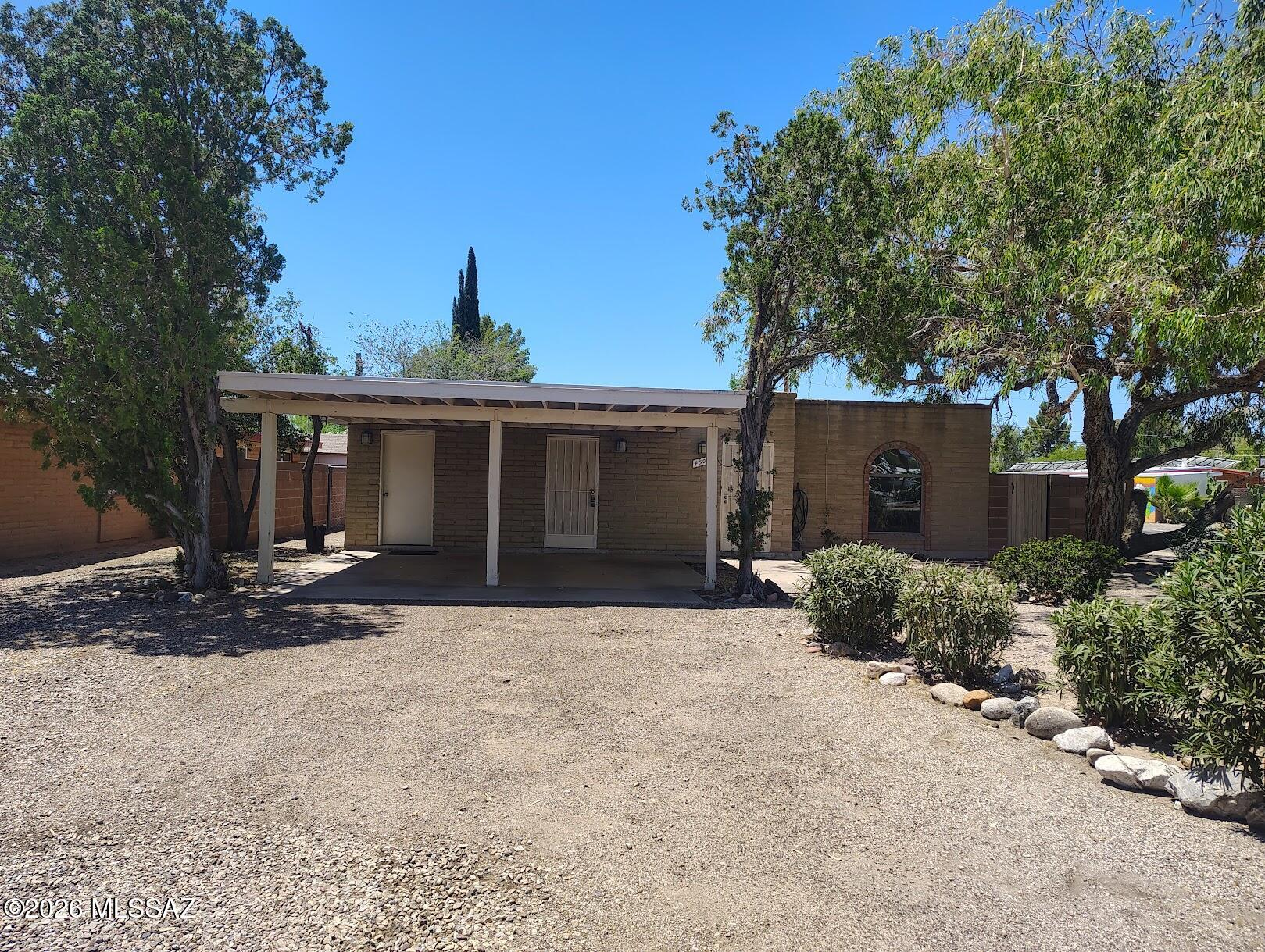 Right in the heart of Tucson, this spacious brick home was just updated with new countertops, bathroom cabinets, freshly painted kitchen cabinets, new fixtures and brand-new luxury plank flooring. It comes with stainless steel appliances, W/D H/U, living room, family room with dining area, central air., large walled back yard, corner lot, with trees, extra storage room in carport, security screen doors, 2-car carport. Great central location close to Plaza Palomino, McCormick Park, shopping and restaurants.