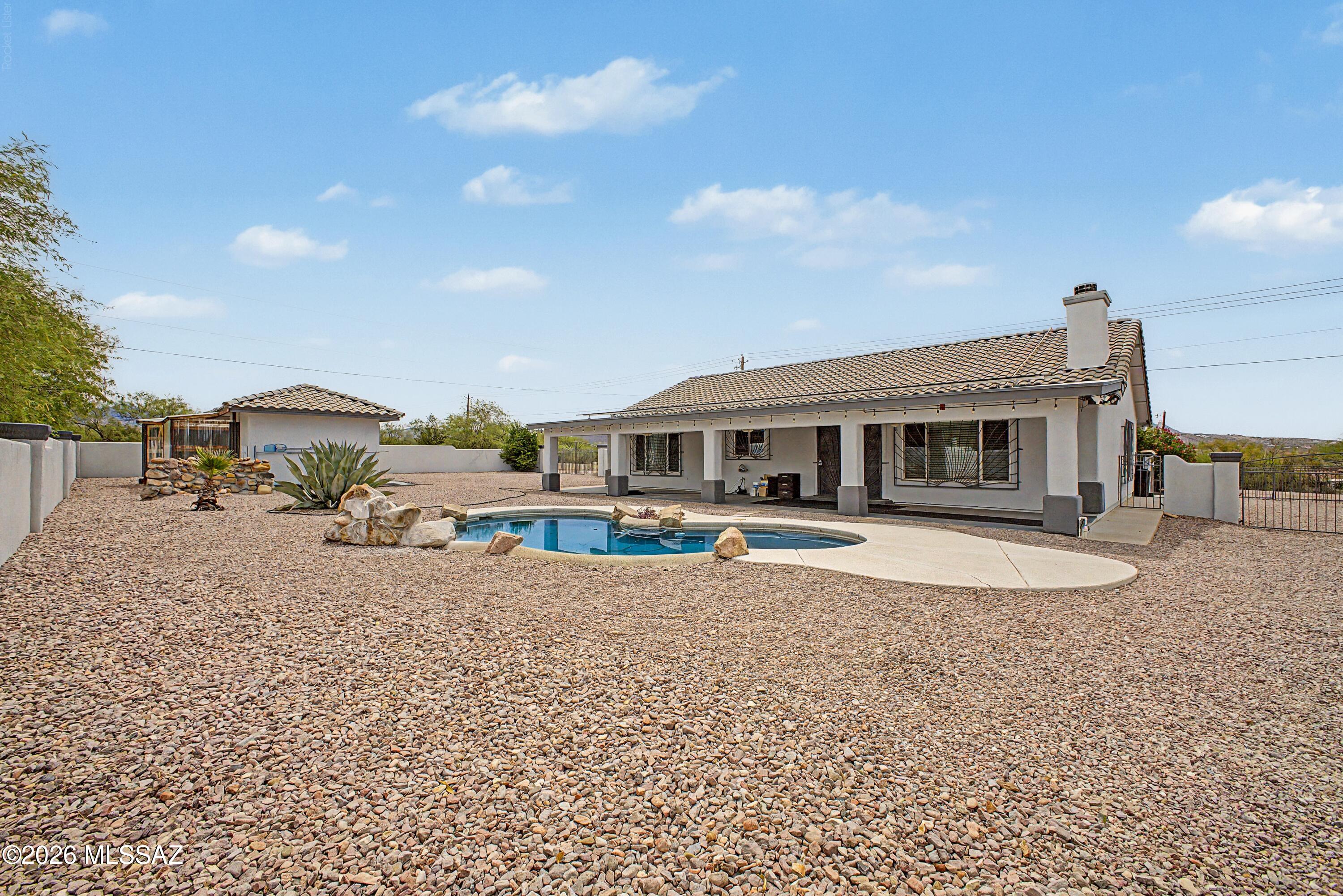 This well-maintained home features ''stone'' tile flooring, new carpet, and fresh interior paint, creating a clean and inviting feel throughout. Enjoy the convenience of a 3-car garage, plus a separate workshop with electricity--ideal for hobbies, storage, projects, or extra workspace.

Step outside to your own private retreat with a sparkling pool and water fountain, perfect for relaxing while taking in the surrounding mountain views. The property is also equipped with full RV hookups, including both 30-amp and 50-amp service, offering excellent flexibility for RV owners or guests. Additional features include solar to help keep electric bills low.