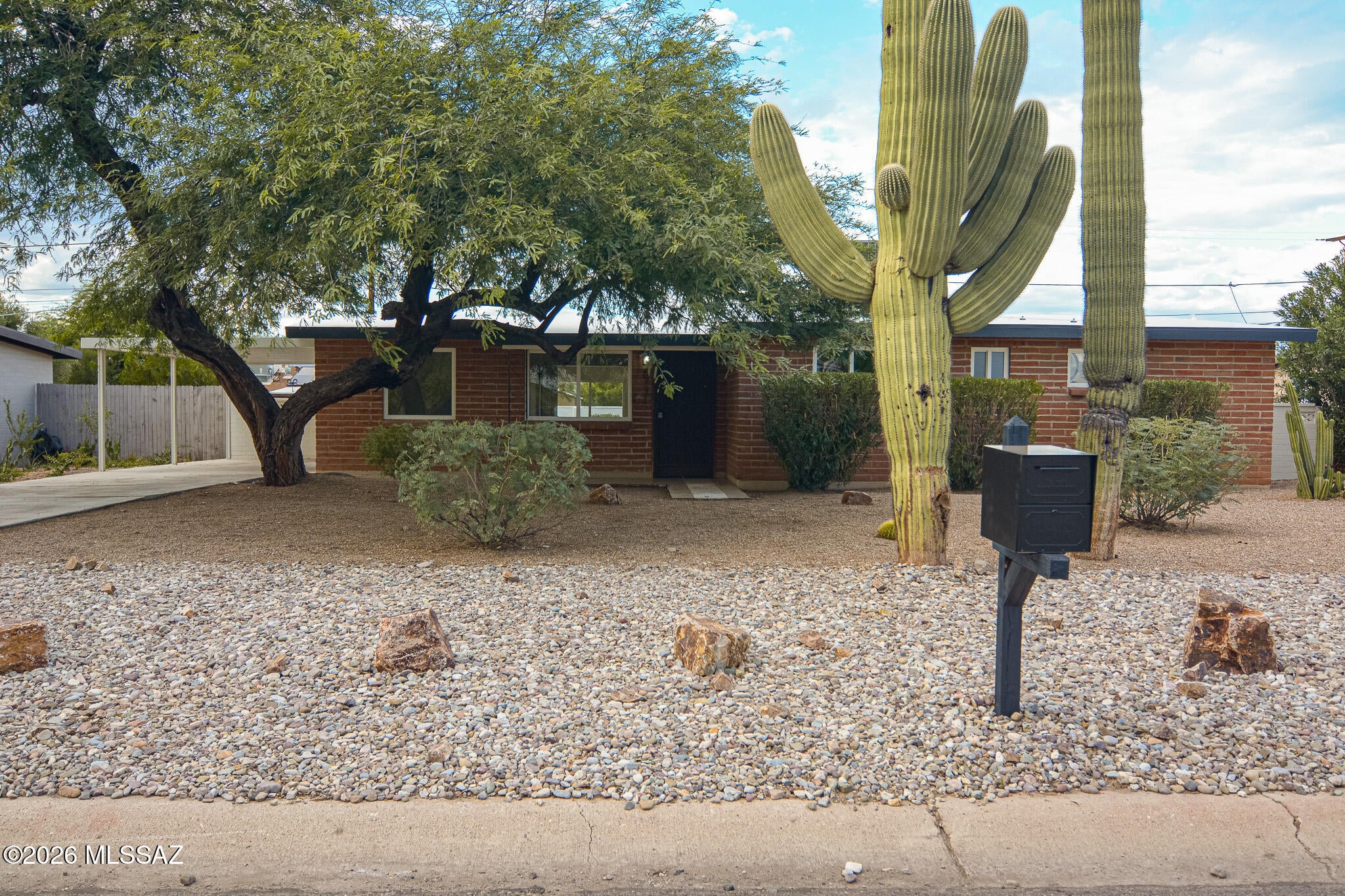 Beautifully remodeled Ranch style home. Located in a convenient Central Tucson location. Charming block construction. Rich earth tone ceramic tile. New carpet and padding in bedrooms. Updated modern kitchen. New SS Stove and dishwasher to be installed. New custom interior and exterior paint. Updated bathrooms. Ceiling fans in each room. Fenced yard. Storage shed. Mature trees. Sparkling pool. Upgraded door hardware and light fixtures. Mountain views. One car carport. No HOA. This home shows beautifully.