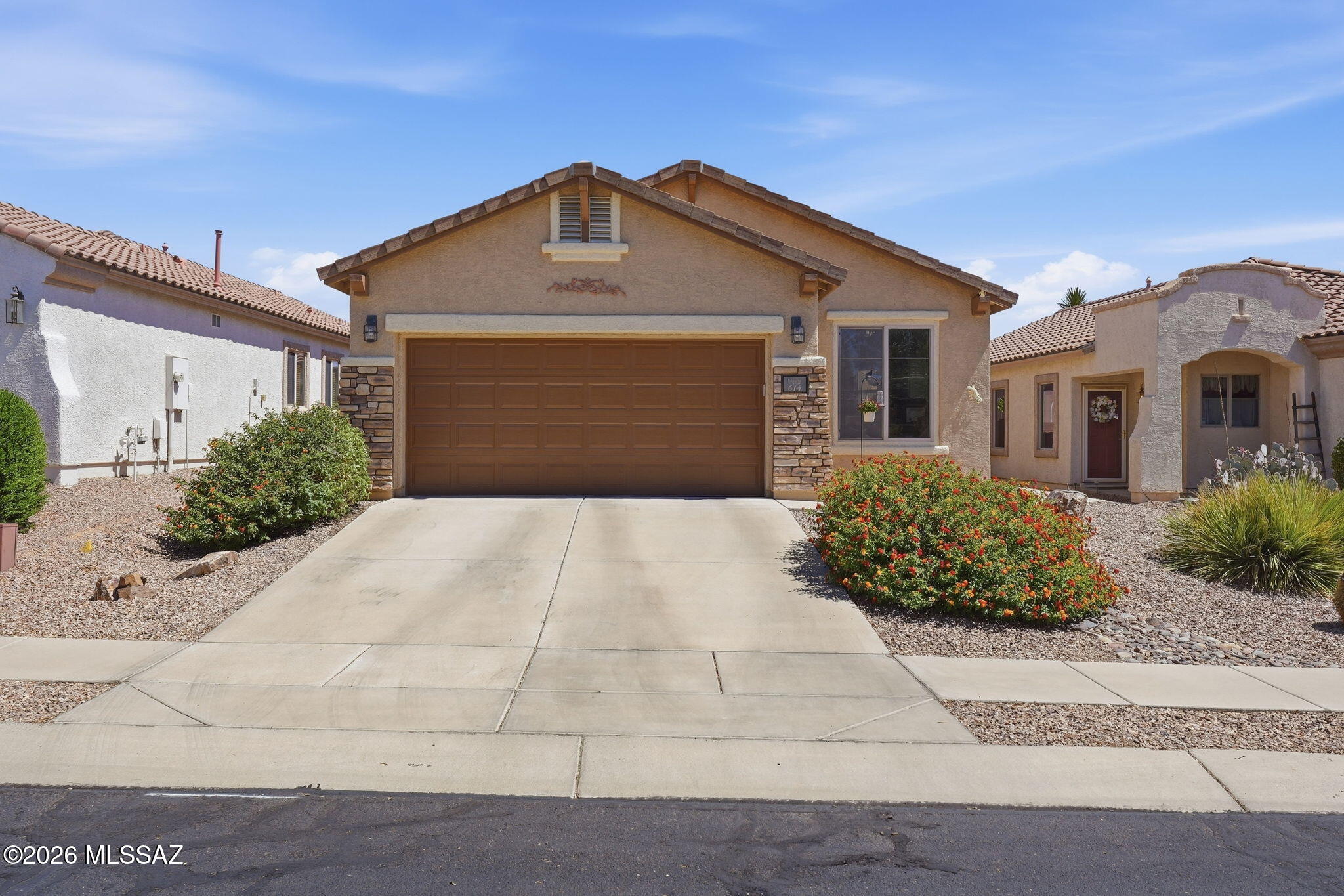 RESORT STYLE LIVING in AWARD WINNING SONORA DEL WEBB 55+ in RANCHO SAHUARITA!!!
This CHARMING and IMPECCABLY maintained home is just STEPS AWAY from the COMMUNITY RECREATION CENTER where YOU can ENJOY the BEAUTIFUL SPARKLING POOL and SPA, PLAY PICKLE BALL, TENNIS, WORKOUT, WALK the LAKE PARK TRAIL, SHOOT POOL, or simply CHILL and RELAX in the LIBRARY. There's literally something for everyone!!! This BEAUTIFUL home FEATURES an INVITING front entrance with STONE accents, an OPEN CONCEPT SPLIT bedroom FLOOR PLAN,  PLUS a separate DEN that could easily be converted to a third bedroom. GORGEOUS kitchen with GRANITE counter tops and STAINLESS STEEL appliances. SUNNY dining area and BREAKFAST BAR. UPGRADED MODERN LIGHTING fixtures and CEILING FANS throughout as well as PLANTATION SHUTTERS. CERAMIC TILE and WOOD LAMINATE flooring throughout. ENCLOSED SCREENED patio for ALL YEAR ENJOYMENT. LOW CARE and maintenance landscape with DRIP IRRIGATION system. ALL APPLIANCES included as well as WATER SOFTENER. This home is TURN KEY and MOVE IN READY!!!