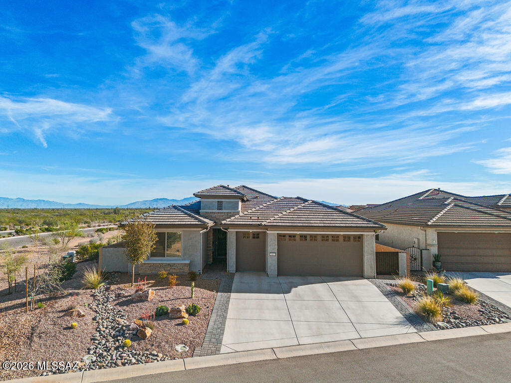 A must see in person, you will be blown away! Highly sought-after and extensively upgraded Mariposa floorplan situated on an elevated corner lot with breathtaking panoramic and mountain views. Designed for both comfort and style, this open-concept home features 10-foot ceilings, abundant natural light, and beautiful LVP flooring throughout -no carpet anywhere. Thoughtful builder extensions include a 4-foot expansion to the primary suite and garage, plus 2-foot extensions to the second bedroom and dining area, creating generous and functional living spaces. The kitchen is beautifully appointed with quartz countertops, upgraded cabinetry with soft-close features, pull-outs, and additional cabinet enhancements throughout. Quartz surfaces continue in the bathrooms for a cohesive, upscale feel. Gorgeous window treatments complement the home, while two 12-foot sliding glass doors in the great room and dining area seamlessly blend indoor and outdoor living, showcasing the stunning views and filling the space with natural light. Step outside to a large covered patio -- perfect for relaxing, entertaining, and enjoying the surrounding mountain and panoramic views.

This exceptional property combines premium upgrades, smart design, and an unbeatable setting.