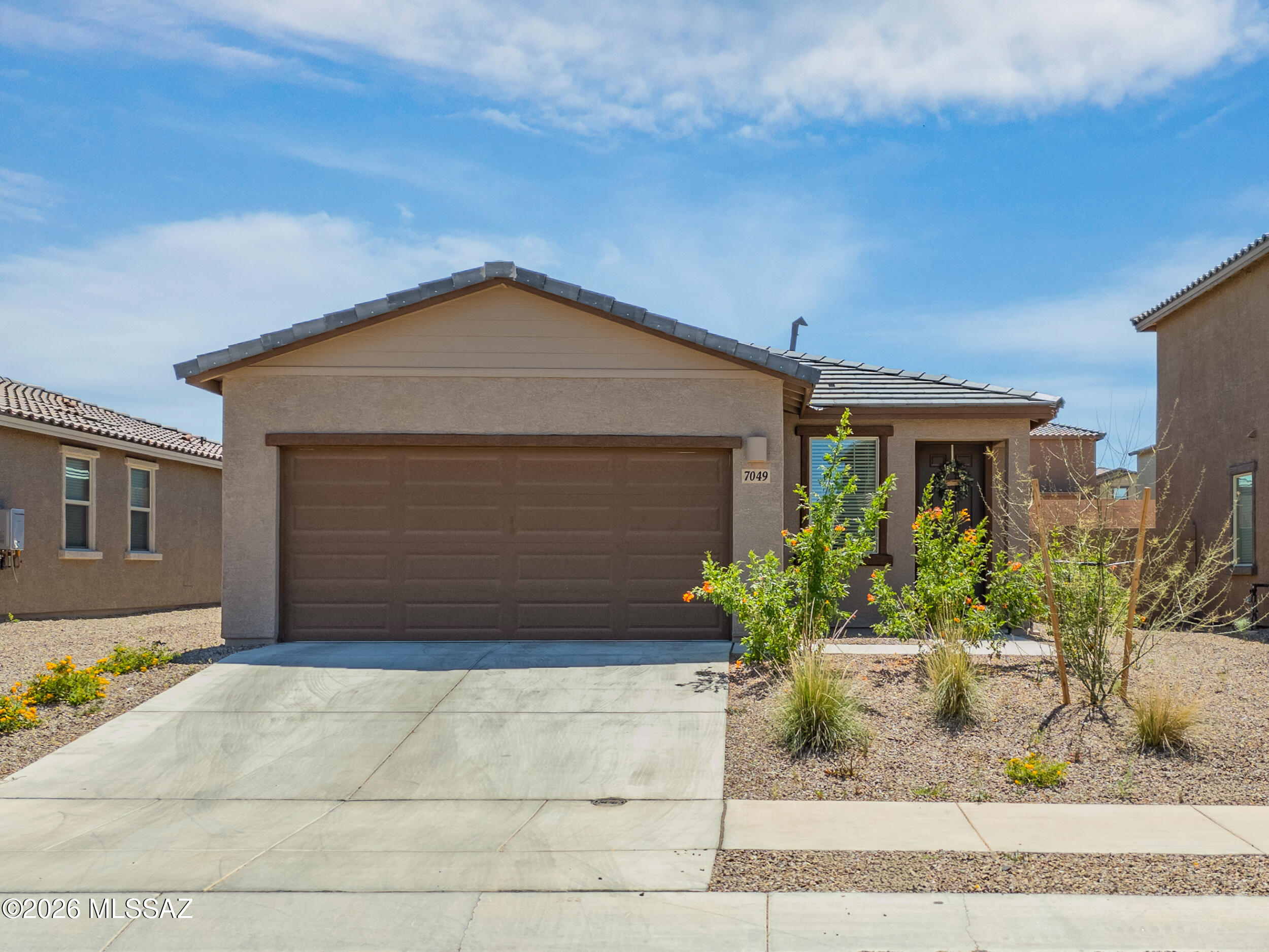 Seller will accept or counter offers from $299,900-$309,900. Welcome to this stunning single story home built for modern living and everyday comfort. Less than a year old, this home offers all the benefits of new construction without the wait, and still includes the peace of mind of a builder warranty. Step into an open concept floor plan where the kitchen, dining, and family room flow seamlessly together, creating a bright and inviting space perfect for entertaining or relaxing. The patio extends your living space outdoors, ideal for weekend gatherings. Three thoughtfully positioned bedrooms provide privacy and flexibility. The owner's suite is tucked toward the back of the home, offering a quiet retreat with a full bathroom designed for comfort and relaxation. Enjoy upgraded features including a tankless water heater, smart thermostat, and faux wood blinds throughout, helping keep utility costs low while maintaining style and efficiency. Skip the build time and move right in. This nearly new, move-in ready home delivers modern design, convenience, and value all in one.