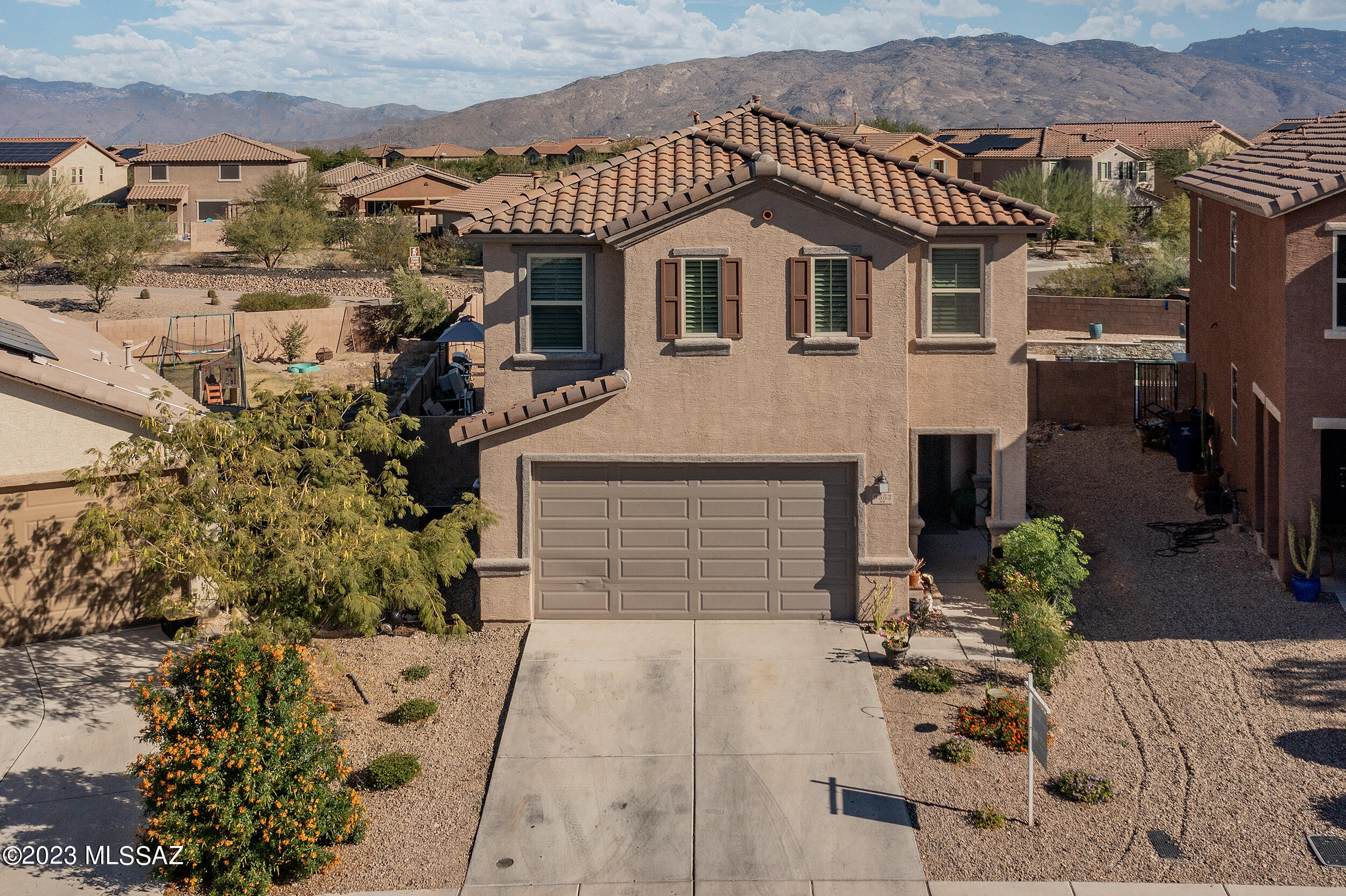This large two story California Contemporary home in situated in the highly ranked Vail School System. This is the largest floor plan that KB Homes built. Featuring one of the larger lots in the neighborhood. This home features one bedroom and full bath on the 1st floor. The open and spacious great room  opens onto the Chef's kitchen with huge island and walk-in pantry. Upstairs are 4 bedrooms plus a loft. The large master suite has a large walk-in closet and large master bath with shower. Esmond Station is one of the top K-8 schools in Vail with a walking path right to the school. All windows throughout have plantation shutters.  You will love the large back yard with Views of the Rincon Mountains! The Seller is offering a $5000 redecorating allowance with a list price offer!