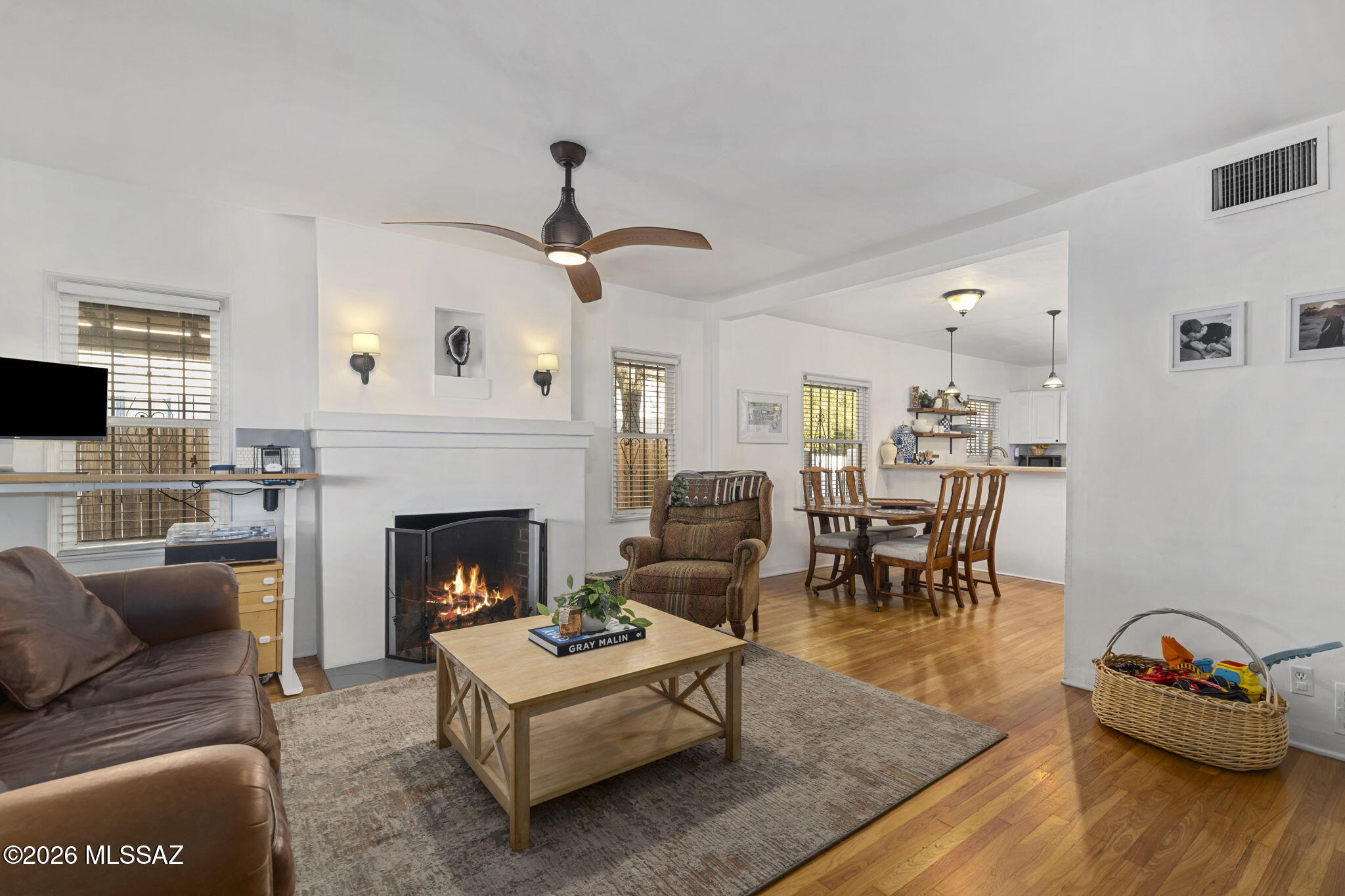 Located minutes from Banner Hospital and the U of A, this charming 1938 historic bungalow blends character, convenience, and income potential. The 1,134 sq ft main home offers 2BD/1BA with wood flooring and a beautiful screened-in porch, while the detached 437 sq ft 1BD/1BA guest house is perfect for rental income, guests, or flexible living. The property features owned solar, new plumbing, gated entry, a 2-car tandem garage, carport, and up to 5 additional parking spaces. Enjoy a low-maintenance backyard with artificial turf. Ideal as a primary residence or investment opportunity, this versatile property offers a rare chance to offset your mortgage while building equity in a highly desirable central location.