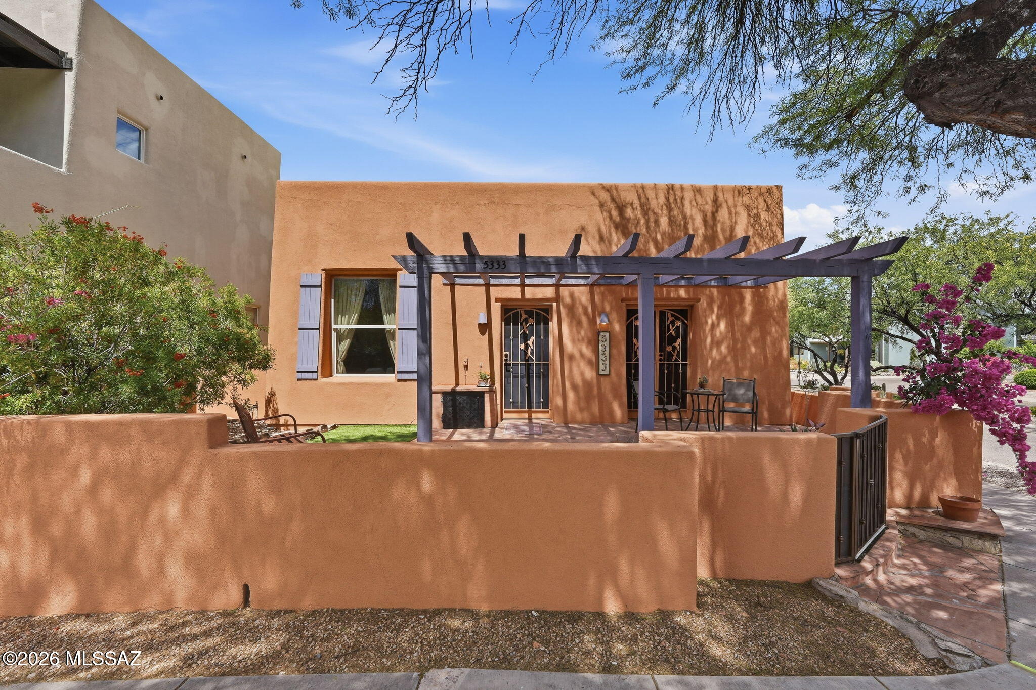 Set on a desirable corner lot with a generous side patio, this beautifully maintained home offers privacy and an abundance of natural light. A welcoming entry gate leads to refreshed landscaping featuring low-maintenance turf and inviting flagstone patios--perfect for relaxing or entertaining outdoors. Elegant security doors, updated ceiling fans and lighting, and a newer refrigerator add comfort and style throughout. Pride of ownership is evident in every detail. For added convenience, the home is available turnkey with the majority of furnishings and household items, making for an effortless move-in or investment opportunity. Located in the sought-after Civano community; a unique neighborhood designed to foster connection, promote sustainability, and support an active lifestyle.