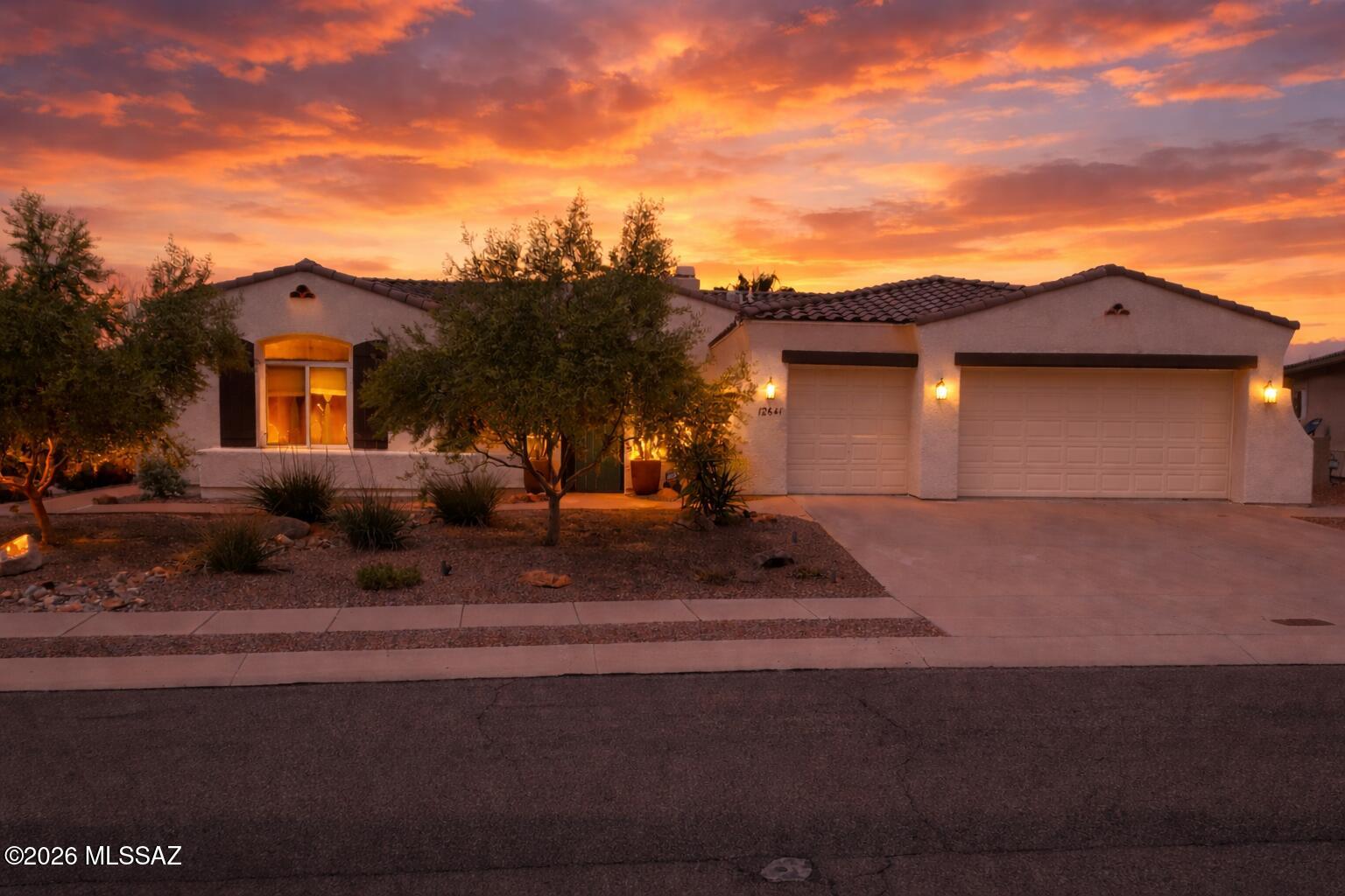 Meticulously maintained premium corner lot property with mountain views front and back. This spacious 3263 sq ft split floor plan home includes 3 full baths. The 4th bedroom would make a great guest quarters or mother in law suite with its own full bath. The gourmet kitchen features stainless steel appliances, granite counters, ample cabinet space and a huge Island with a breakfast bar. The kitchen opens to a spacious family room with an imposing bee hive fireplace. The large primary bedroom suite has a separate sitting area for reading, exercise area, library, etc. with an ensuite bath having dual vanities and a large walk in shower. Recent upgrades include HVAC 2022 dual zone, multi stage, roof 2024, water heater 2018, remodeled bathrooms 2024, Viking gas cooktop in the kitchen. Retreat to the park like back yard with mountain views and a pebble tech pool & spa. Pool motor is about 2 years old. Enjoy Tucson's cool evenings around the outdoor beehive fireplace  This turn key luxury home is ready for it's new owners! Take a look today!