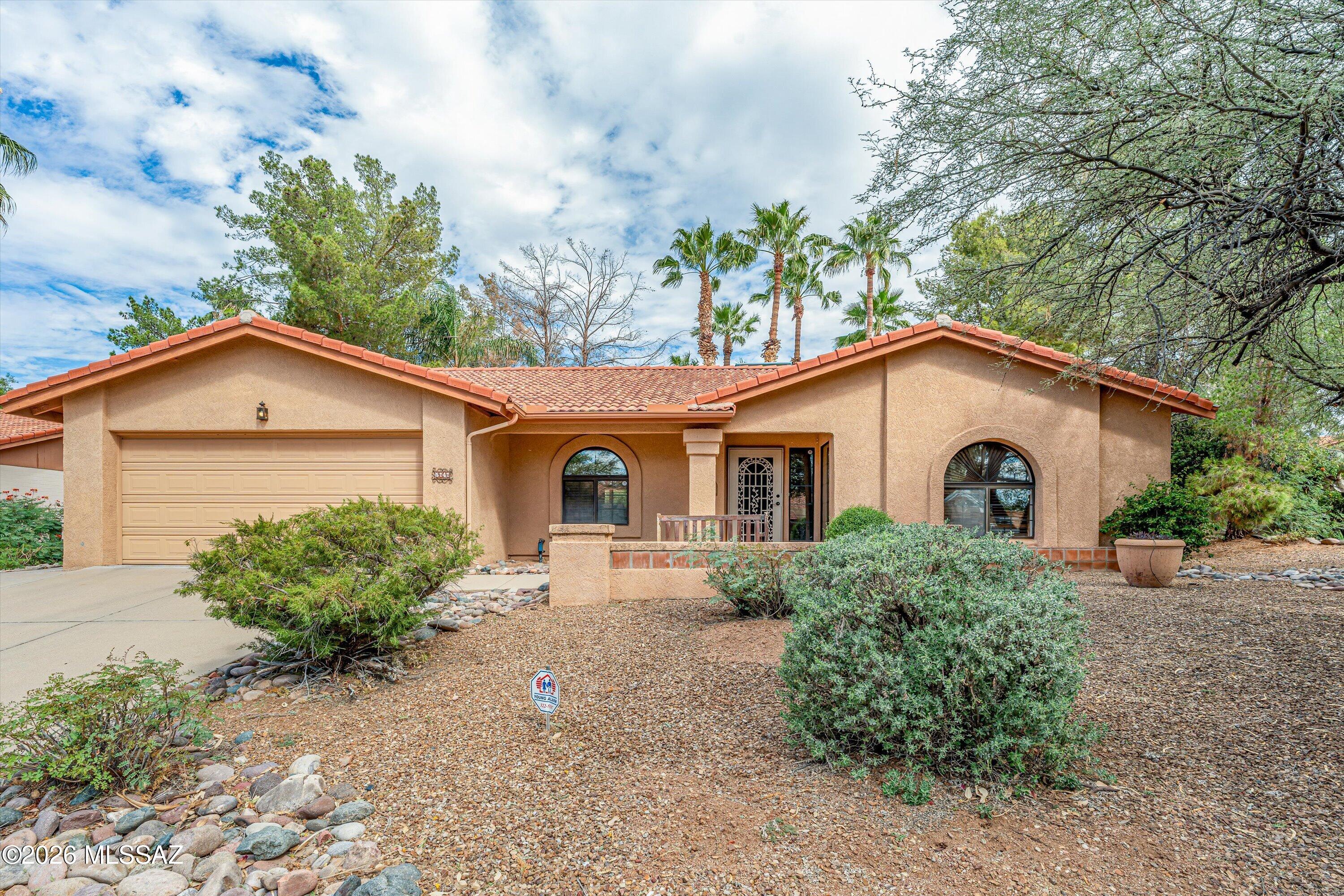 Classic Tucson living in this masonry stucco home with tile roof, set on a large yard built for outdoor enjoyment. Relax in the heated pool and spa, entertain under the expansive covered patio, or put the separate concrete slab to work as a second outdoor living area or sports court. Inside, the updated kitchen features stainless appliances, a pantry and eat-in dining, complemented by a formal dining room and separate living room. The primary suite offers a private retreat with an updated bath, separate soaking tub and French door access to the patio. Three additional generously sized bedrooms provide room for guests, hobbies or a home office. Four bedrooms, thoughtful updates and resort-style backyard amenities make this one a must-see. Schedule your showing today!