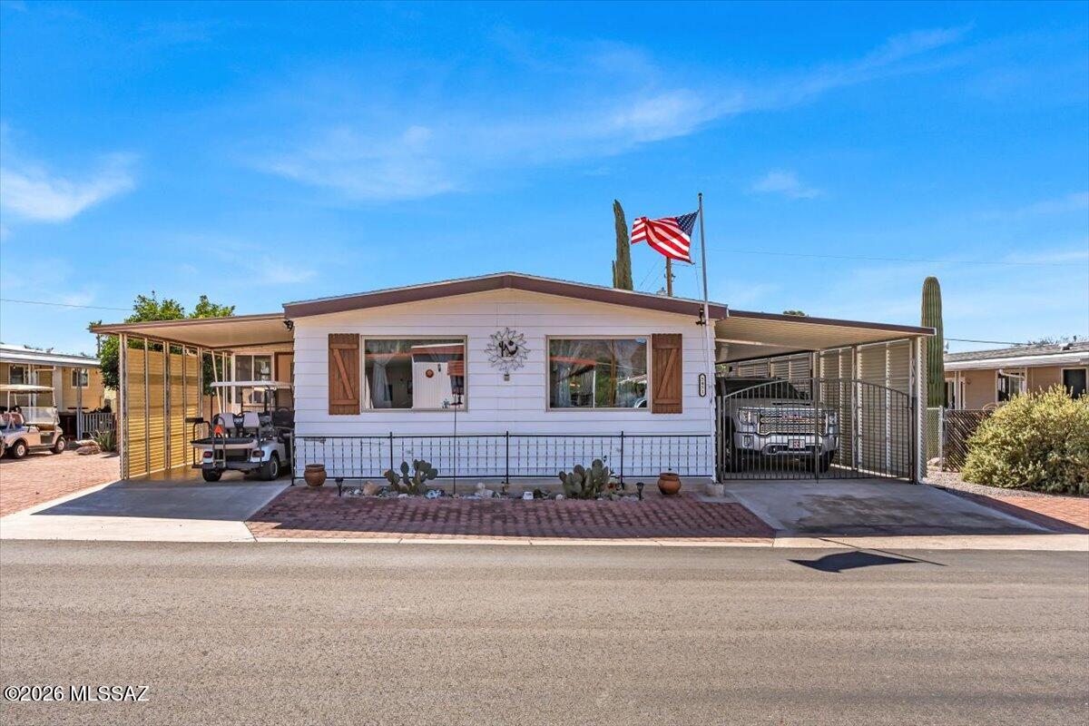 You own the Land! 3-bedroom home featuring breathtaking mountain views from the front windows. The kitchen is equipped with newer Corian countertops, a gas cooktop, and double ovens. Relax in the enclosed Arizona Room, which offers scenic vistas and an additional 130 sq ft of living space (not in listing SFT) cooled by a dedicated mini-split. All bedrooms boast walk-in closets for ample storage. The primary suite features a walk-in shower, while the hall bath offers a luxurious Jacuzzi tub combo. Hobbyists will love the extra-large, climate-controlled workshop with AC. Nice fenced outdoor space. HOA incl. Golf, 2 pools, 2 spa, Pickleball, Exercise Fac, and more. Hiking Trails nearby.