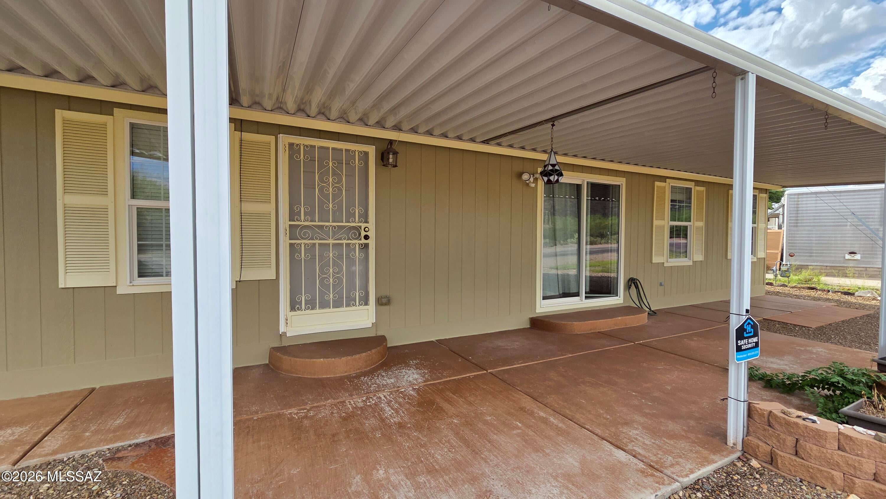 This charming corner-lot home on the widest street in the neighborhood features stunning mountain views, covered patios on both sides, and plenty of outdoor storage and parking. Inside, the open-concept floor plan offers vaulted ceilings, ceiling fans, built-in shelving, plush carpeting, and abundant natural light. The spacious kitchen includes tile countertops, pendant lighting, and ample wood cabinetry with hardware for plenty of storage. A brand-new roof was installed in March 2026 with a transferable warranty and new water heater! 
Located in the desirable Tucson Estates 55+community, residents enjoy great amenities including golf, pools, tennis courts, walking paths, and an active lifestyle. Enjoy beautiful Arizona skies, mountain views, and comfortable desert living. Must See!!