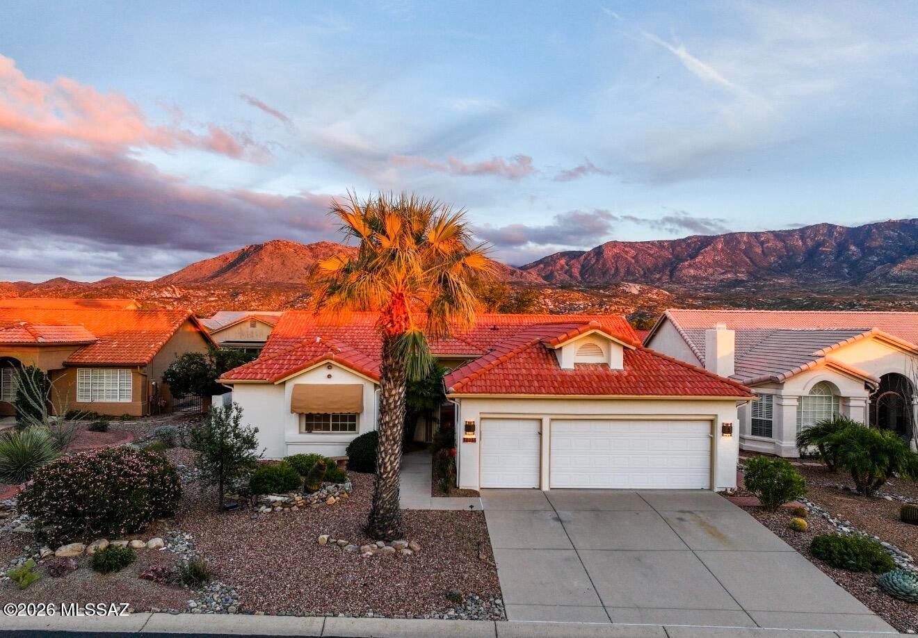 Discover the best of Arizona living in the desirable SaddleBrooke community! Featuring beautiful mountain views, this inviting 2-bedroom plus den, 2.5-bath home offers a spacious, functional floor plan with neutral finishes throughout. The bright kitchen features abundant cabinetry and generous counter space, complemented by comfortable living and dining areas ideal for everyday living and entertaining. A versatile den provides flexibility for a home office, hobby room, or additional sitting area. The primary suite features an en-suite bath with dual vanities and a walk-in shower. Step outside to a peaceful desert retreat featuring an expansive covered patio, ceiling fans, retractable awnings, mature desert landscaping, brick walkways, and a tranquil rock water feature. The golf cart and hot tub are included in the sale, adding even more value to this exceptional property! Enjoy SaddleBrooke's resort-style amenities, including golf, fitness centers, swimming pools, dining, and a variety of social activities. Experience comfort, convenience, and the vibrant SaddleBrooke lifestyle!