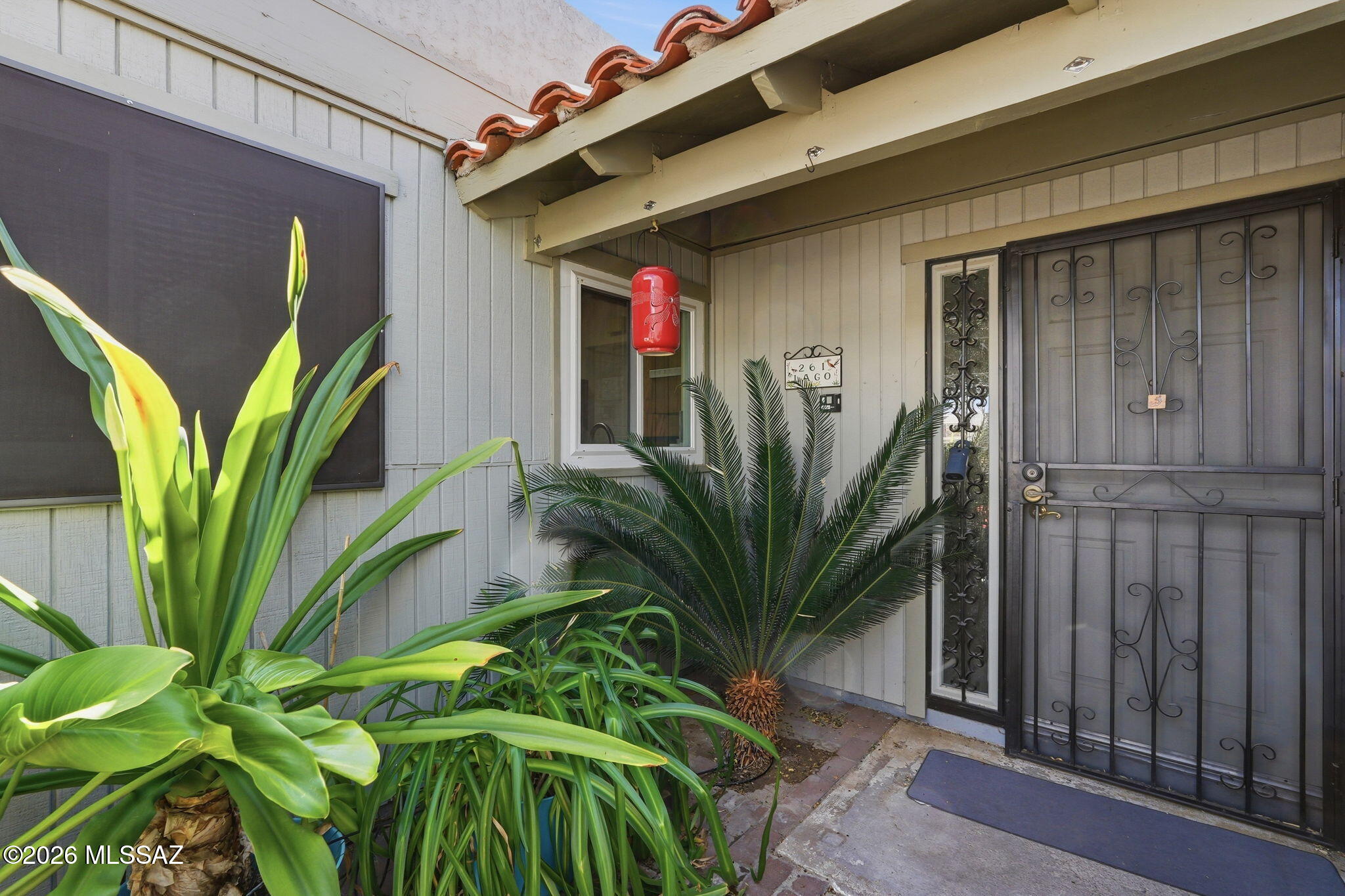 This charming 2-bedroom, 2-bathroom home is move-in ready! The kitchen features stainless steel appliances, granite countertops, and convenient roll-out shelves for easy storage and organization. Skylights throughout the home brighten the space with warm natural light, creating an inviting atmosphere.

The guest bedroom includes built-in shelving, perfect for added storage or display space, while the spacious primary bedroom offers double closets. Newer windows provide energy efficiency and comfort throughout the home. Enjoy relaxing in the enclosed patio, ideal for morning coffee.
The backyard is designed for gardening enthusiasts, complete with raised garden beds and a rain barrel for sustainable living. This well-maintained home is close to main stores, restaurants and the freeway.